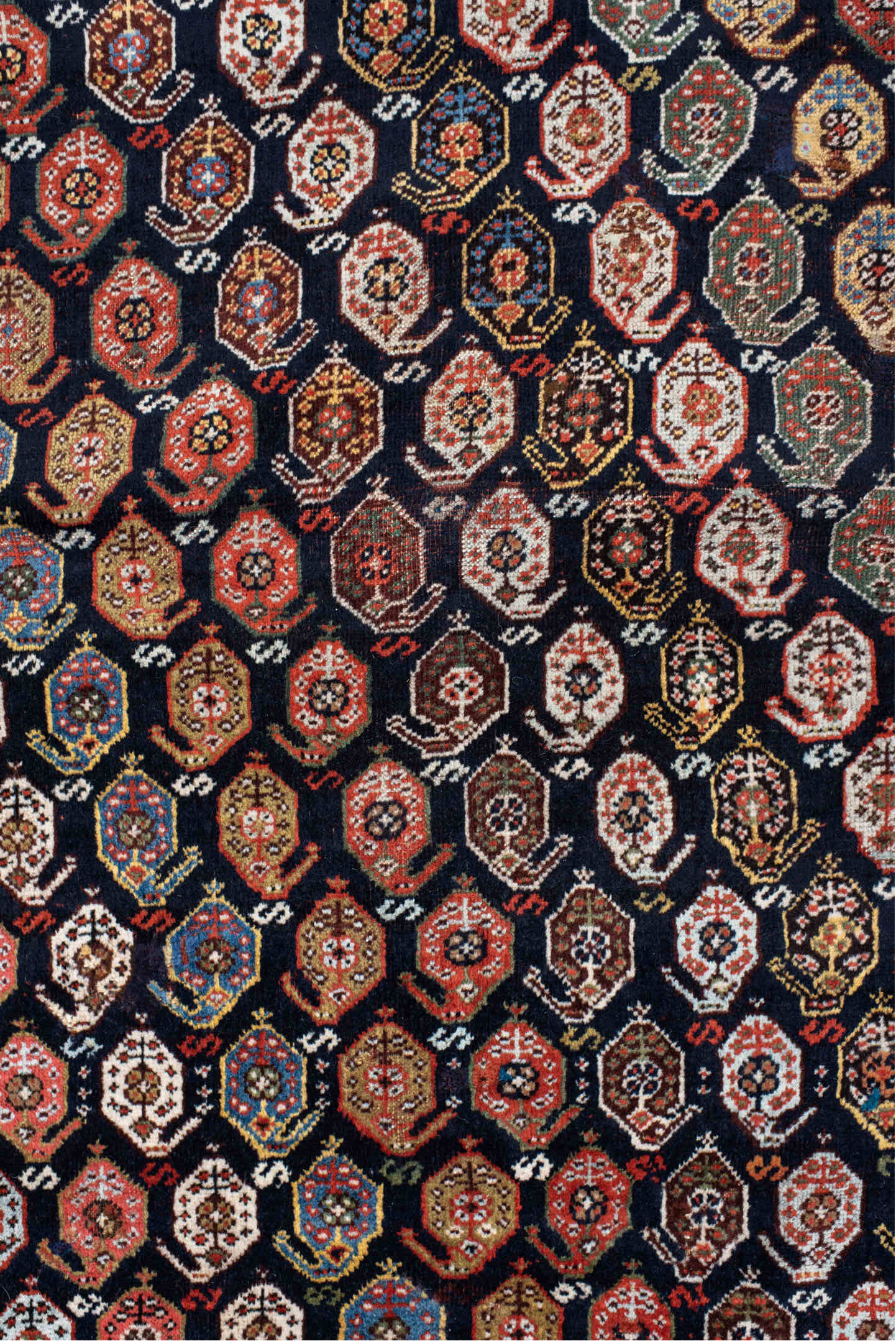 5' x 7' one-of-a-kind handmade vintage Qashqai rug. Color palette: ivory, charcoal, rust, crimson, indigo, camel, slate