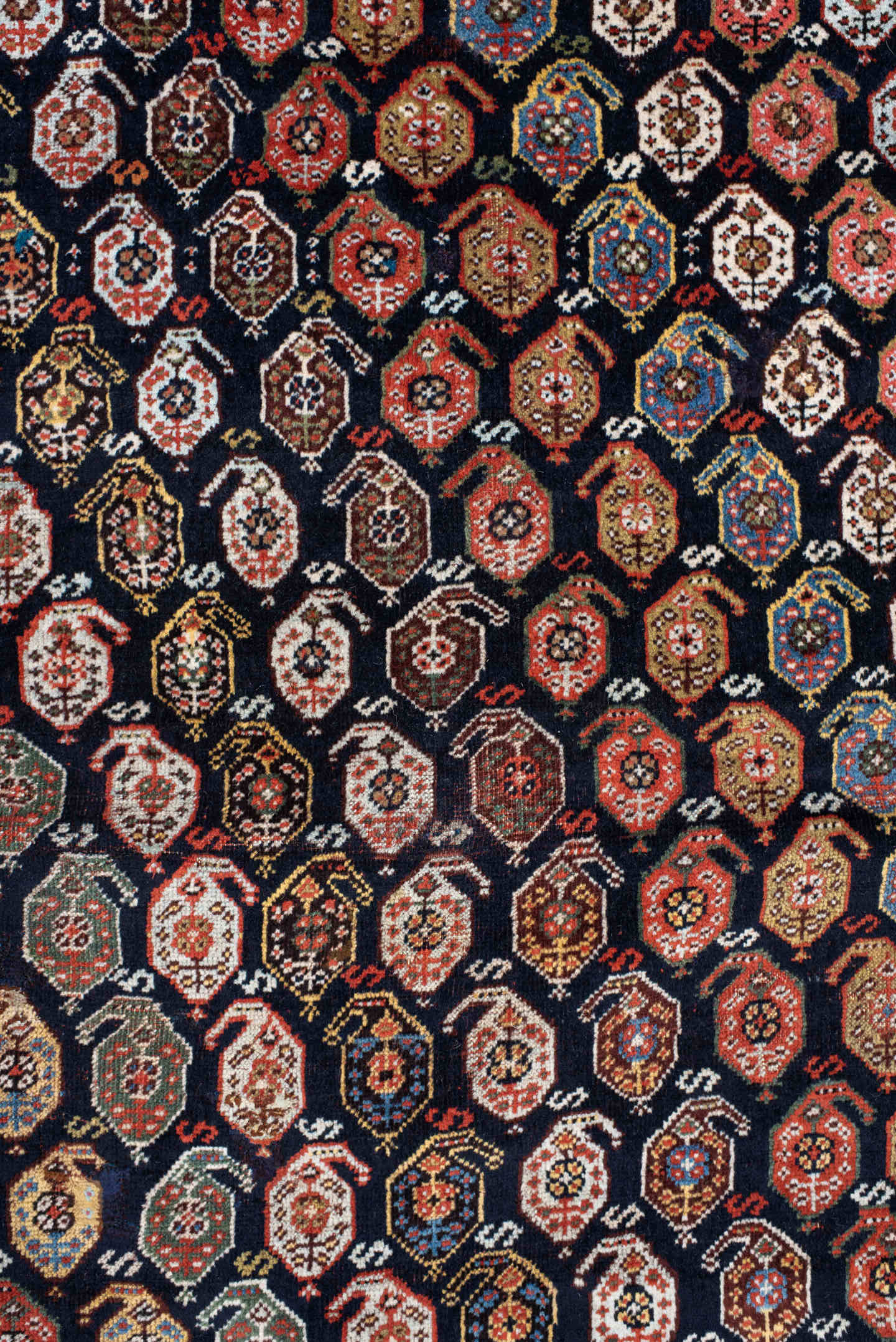 5' x 7' one-of-a-kind handmade vintage Qashqai rug. Color palette: ivory, charcoal, rust, crimson, indigo, camel, slate