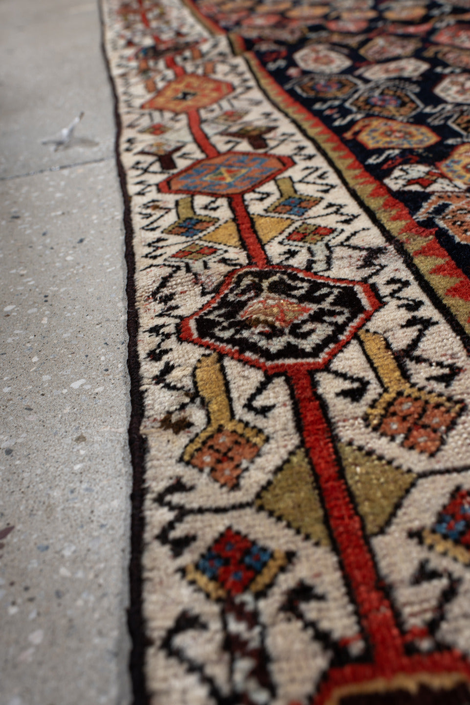 5' x 7' one-of-a-kind handmade vintage Qashqai rug. Color palette: ivory, charcoal, rust, crimson, indigo, camel, slate