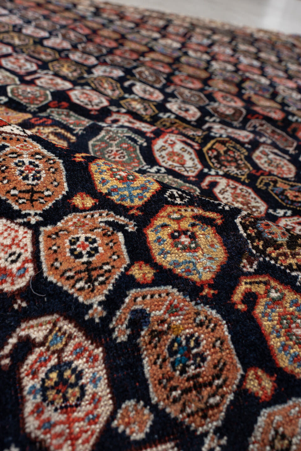 5' x 7' one-of-a-kind handmade vintage Qashqai rug. Color palette: ivory, charcoal, rust, crimson, indigo, camel, slate
