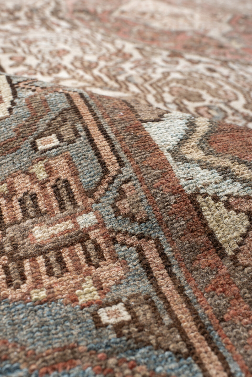 5' x 8' one-of-a-kind handmade antique Baktiary medium size rug. Color palette: ivory, dusty blue, rust, taupe, brown