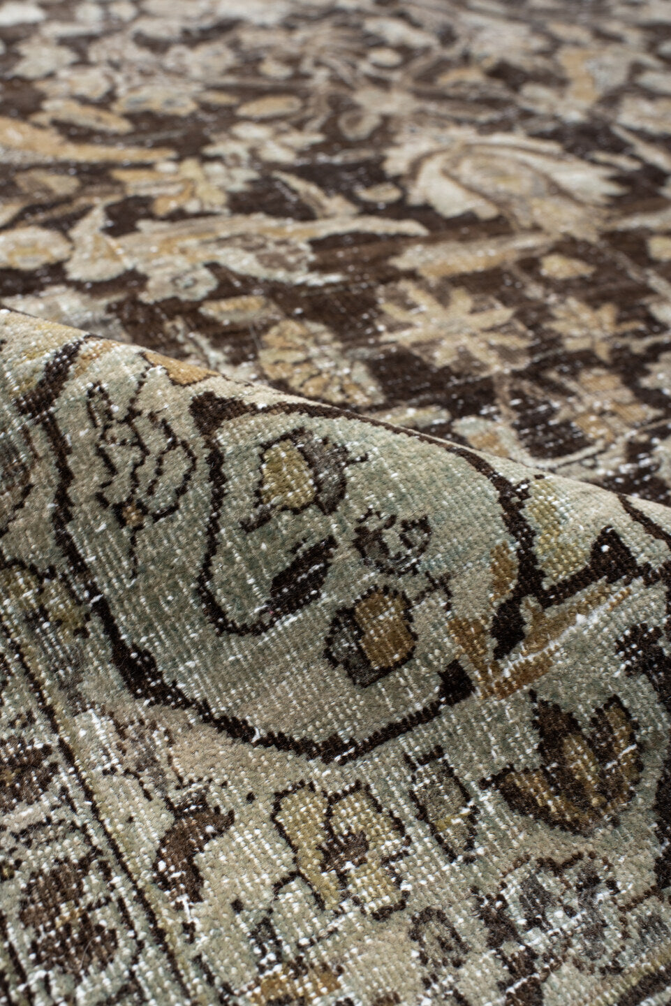 4' x 7' one-of-a-kind handmade vintage Baktiary rug. Color palette: ivory, charcoal, taupe, slate, camel, brown, beige, gray