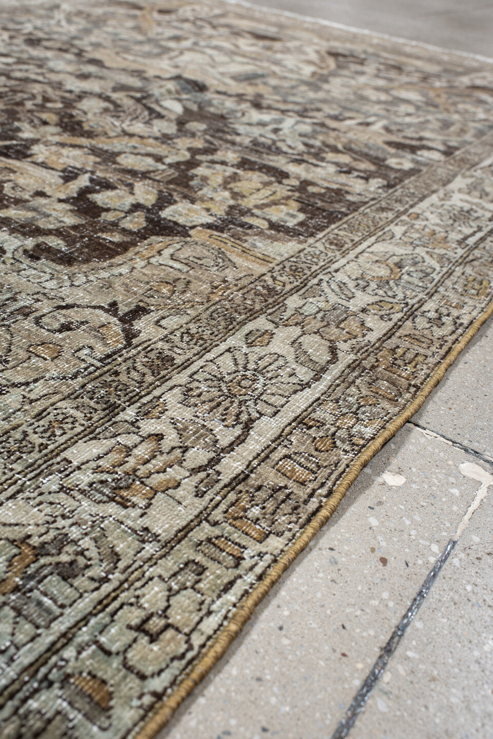 4' x 7' one-of-a-kind handmade vintage Baktiary rug. Color palette: ivory, charcoal, taupe, slate, camel, brown, beige, gray