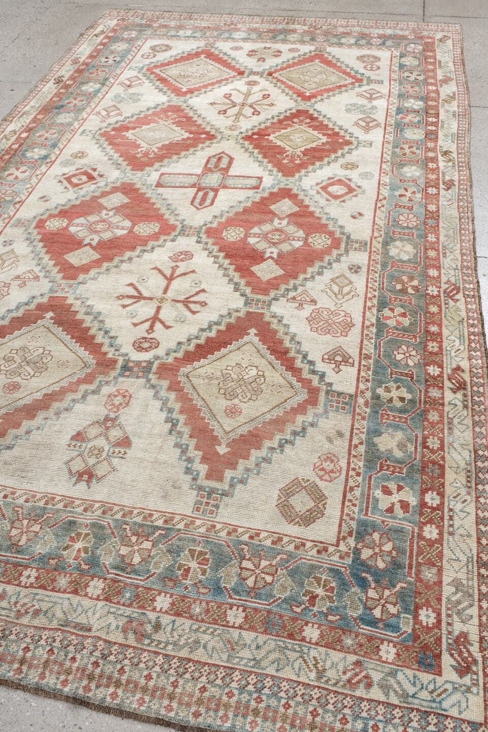 5' x 10' one-of-a-kind handmade vintage Shiraz medium size rug. Color palette: ivory, terra cotta, sky blue, rust, beige