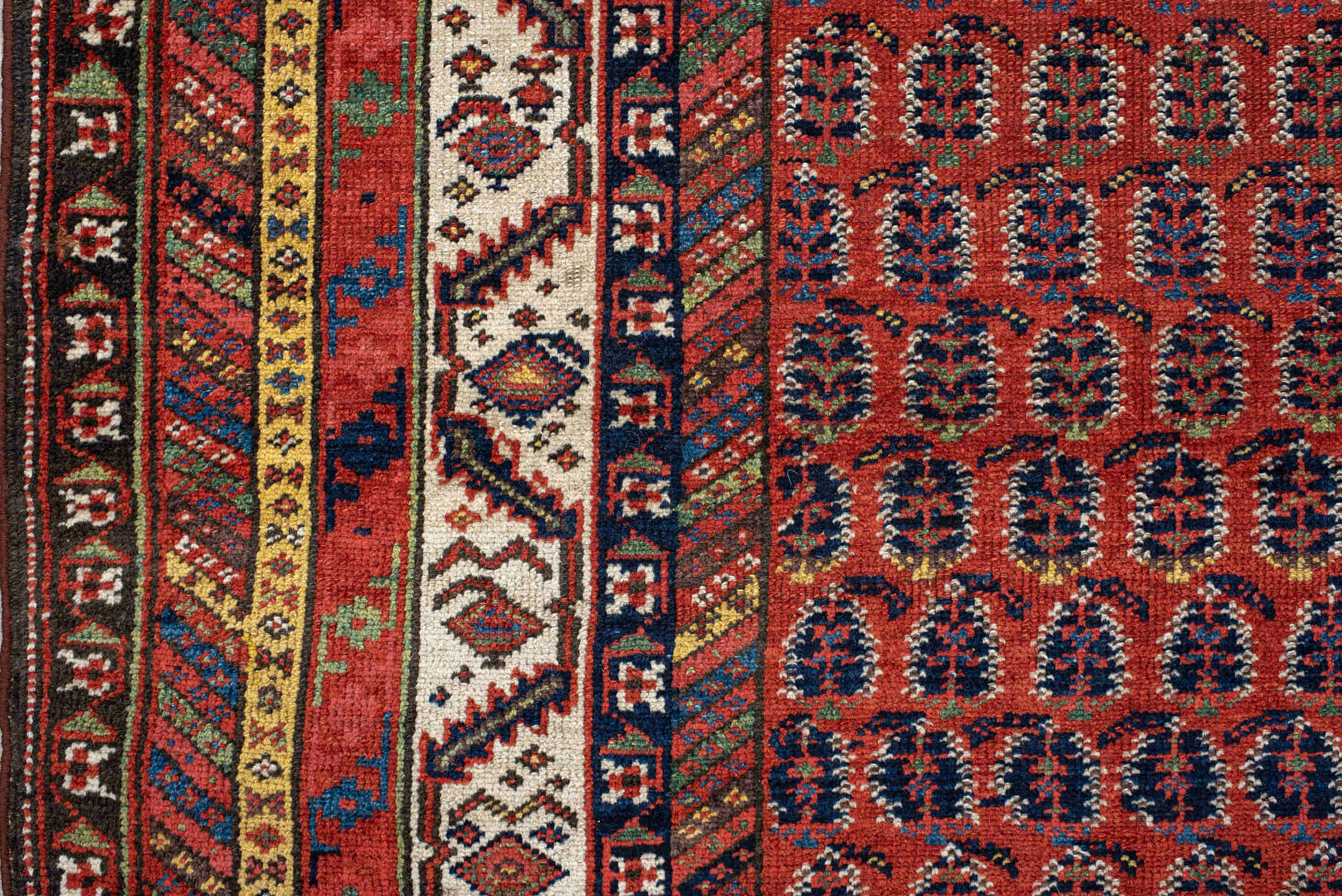4' x 11' one-of-a-kind handmade antique NW Persian runner rug. Color palette: rust, ivory, indigo, navy, terra cotta, camel
