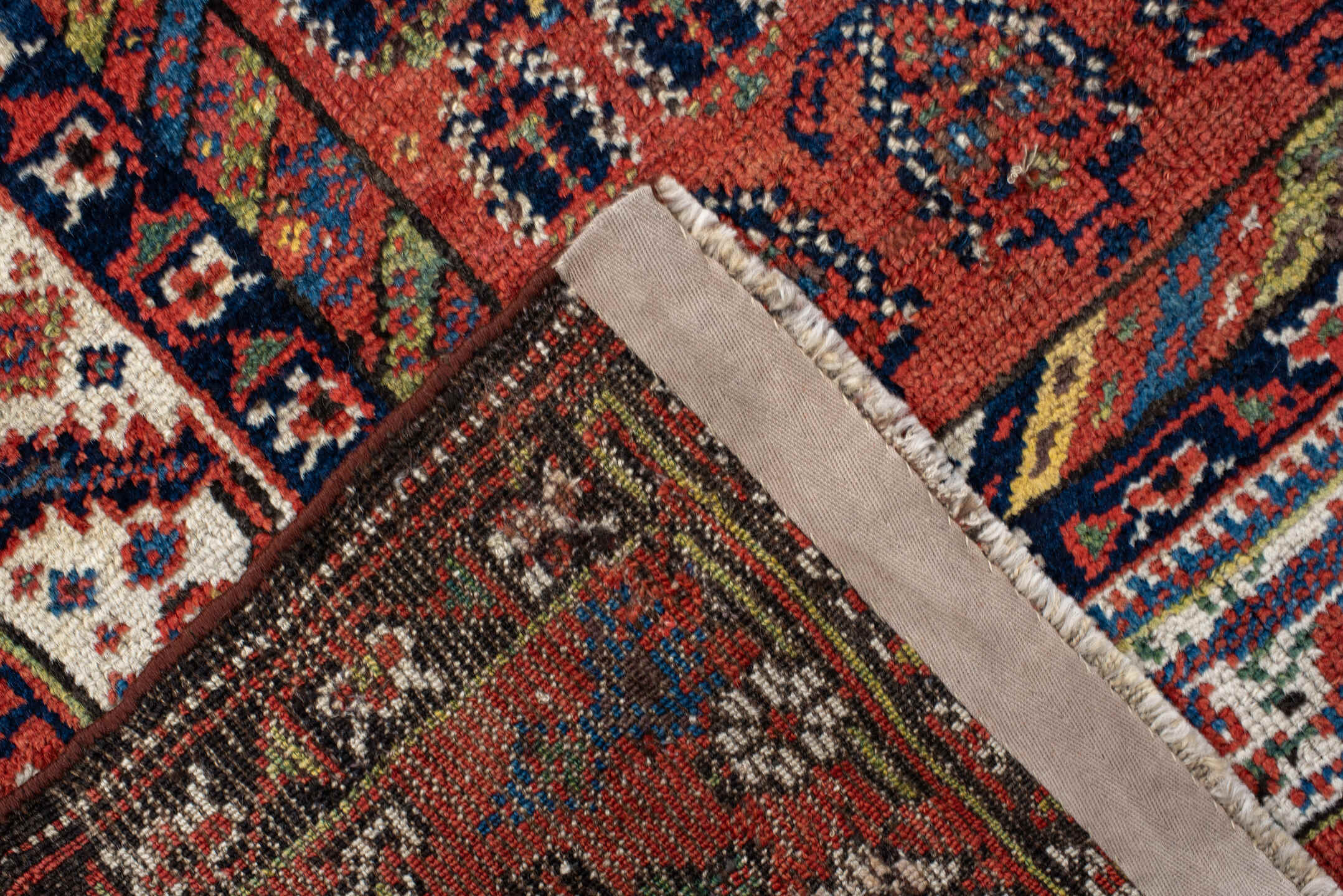 4' x 11' one-of-a-kind handmade antique NW Persian runner rug. Color palette: rust, ivory, indigo, navy, terra cotta, camel
