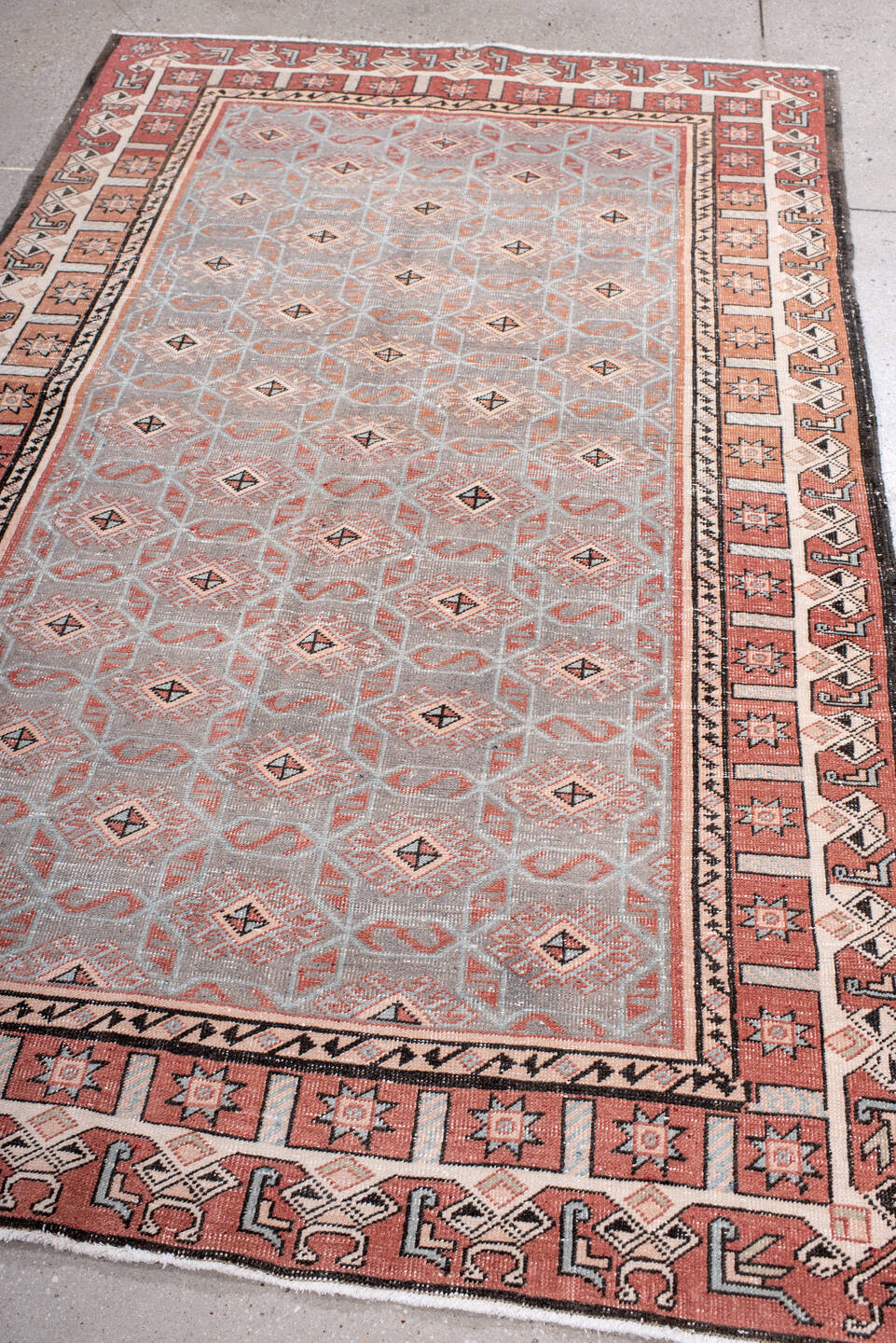 4' x 7' one-of-a-kind handmade vintage Sparta rug. Color palette: black, brown, gray, light gray, off-white, pink, red