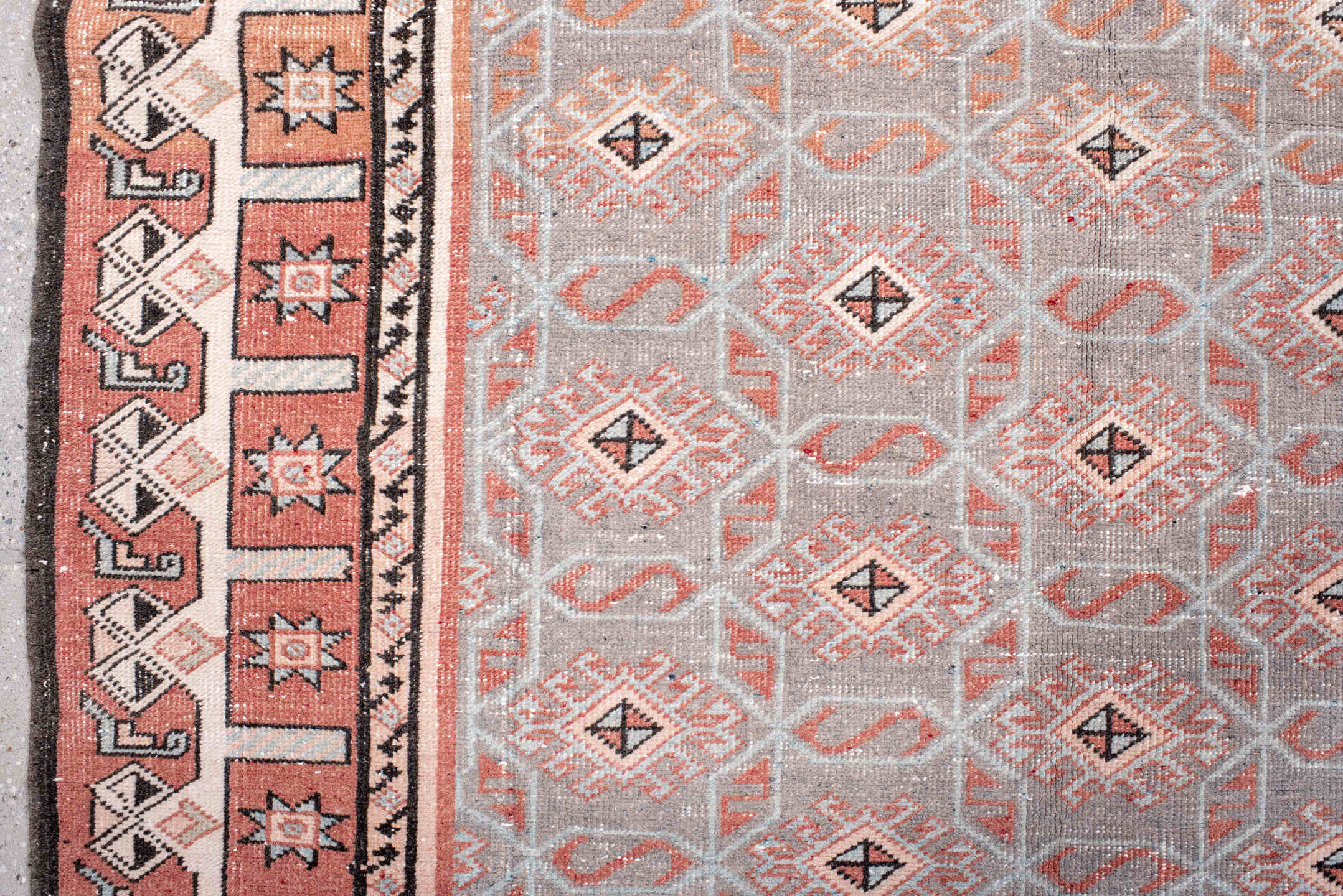 4' x 7' one-of-a-kind handmade vintage Sparta rug. Color palette: black, brown, gray, light gray, off-white, pink, red