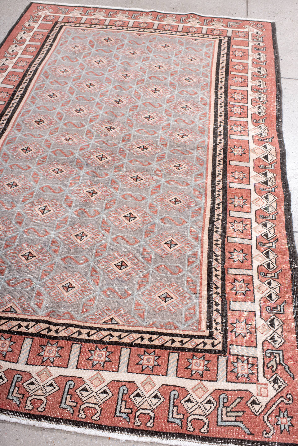 4' x 7' one-of-a-kind handmade vintage Sparta rug. Color palette: black, brown, gray, light gray, off-white, pink, red