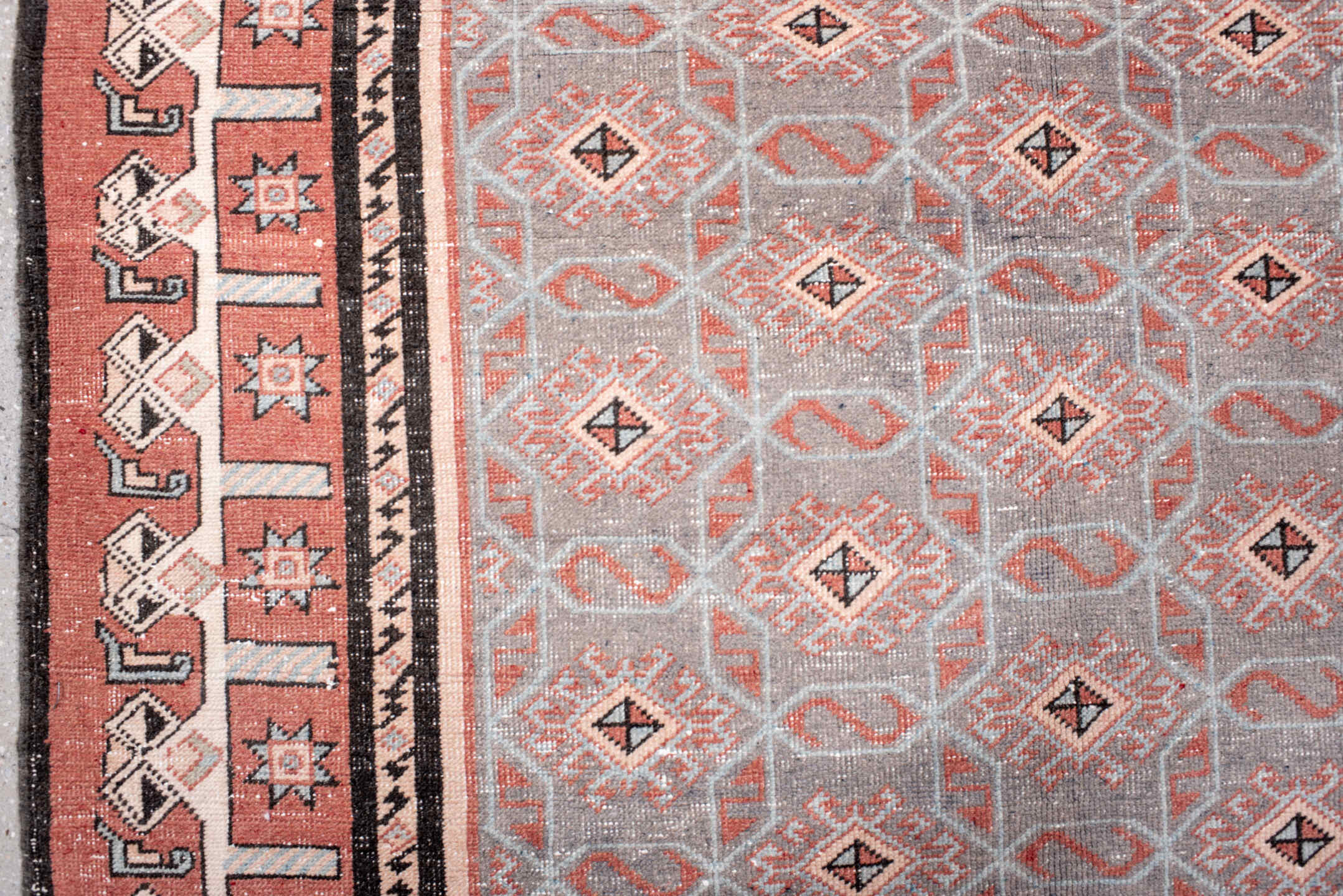 4' x 7' one-of-a-kind handmade vintage Sparta rug. Color palette: black, brown, gray, light gray, off-white, pink, red