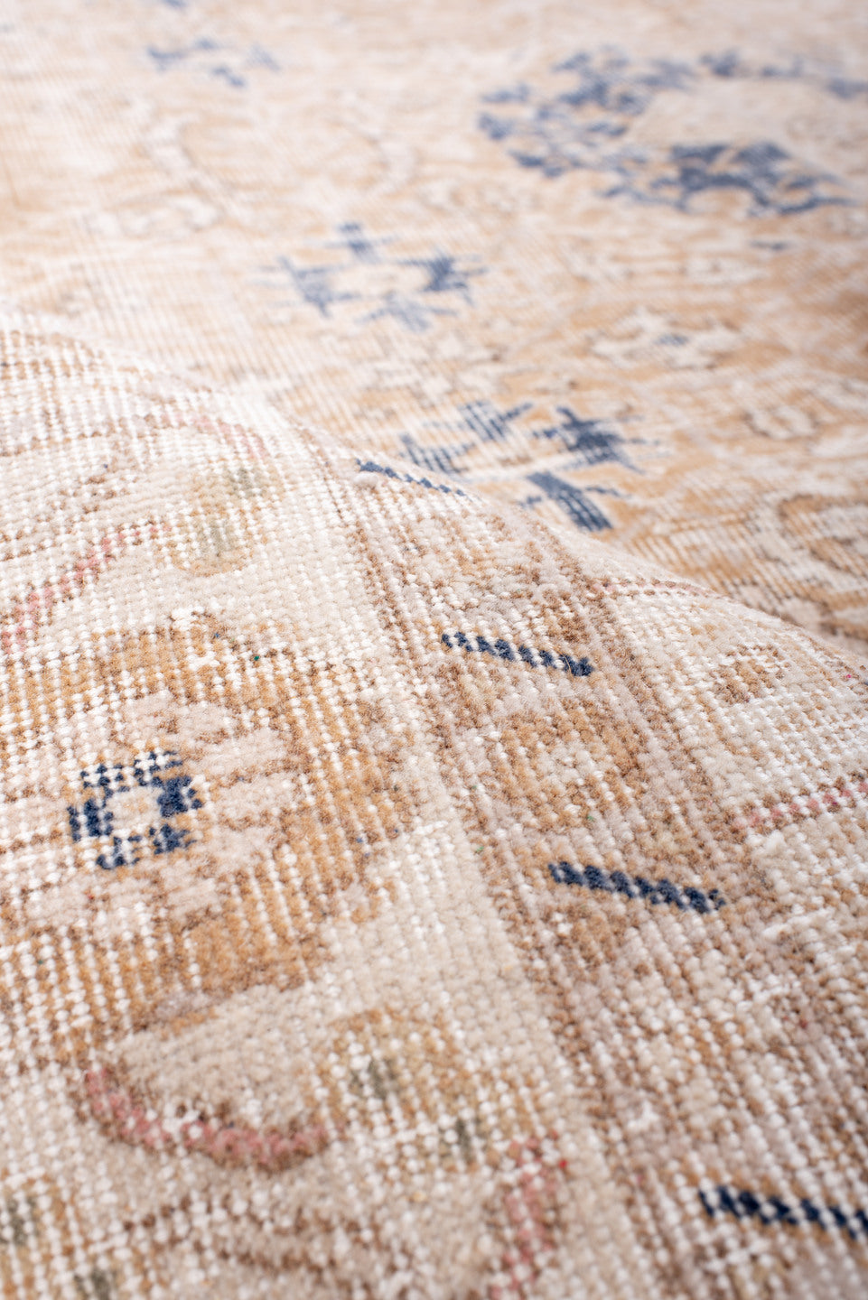 6' x 10' one-of-a-kind handmade vintage Sparta large size rug. Color palette: ivory, peach, beige, indigo, taupe, camel