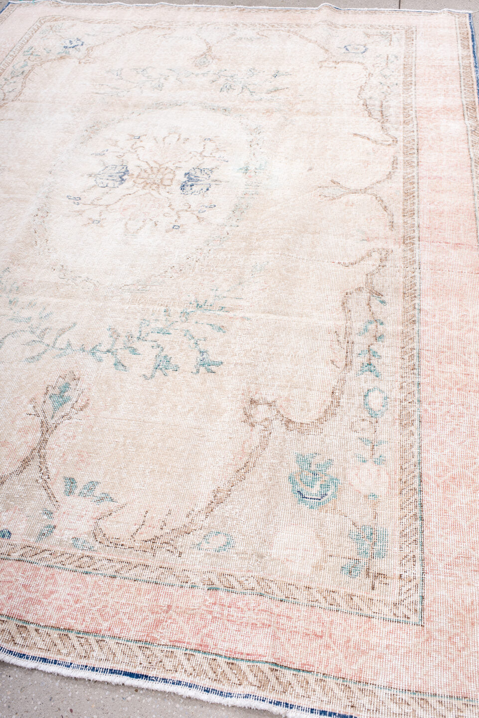 7' x 9' one-of-a-kind handmade vintage Sparta rug. Color palette: blush, ivory, pale blue, taupe, cream, pink, light blue