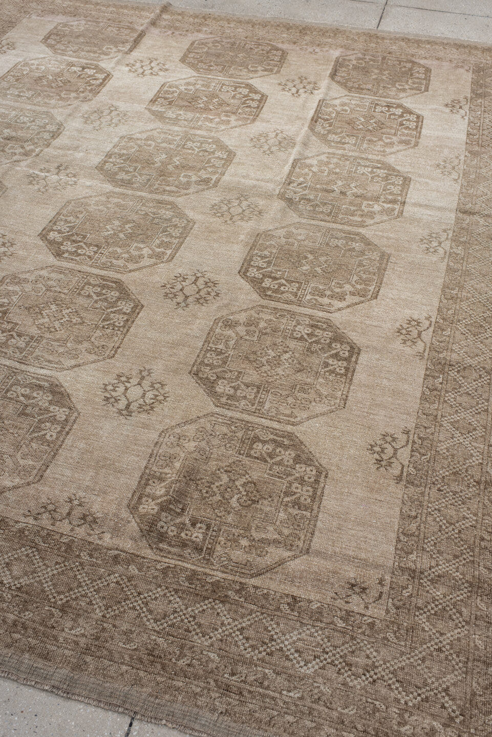 7' x 8' one-of-a-kind handmade antique Afghan rug. Color palette: ivory, taupe, camel, beige, sand, brown, gray