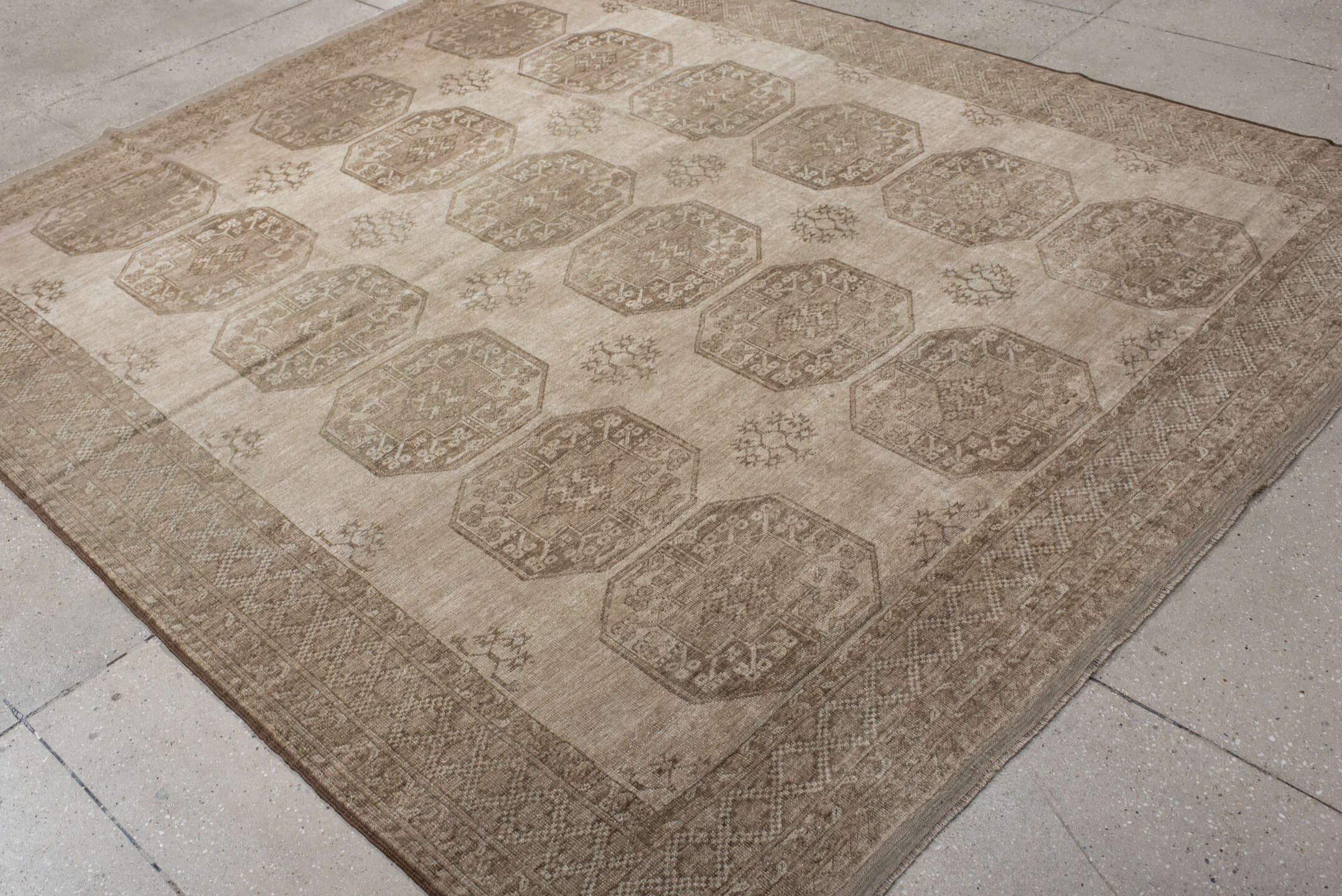 7' x 8' one-of-a-kind handmade antique Afghan rug. Color palette: ivory, taupe, camel, beige, sand, brown, gray