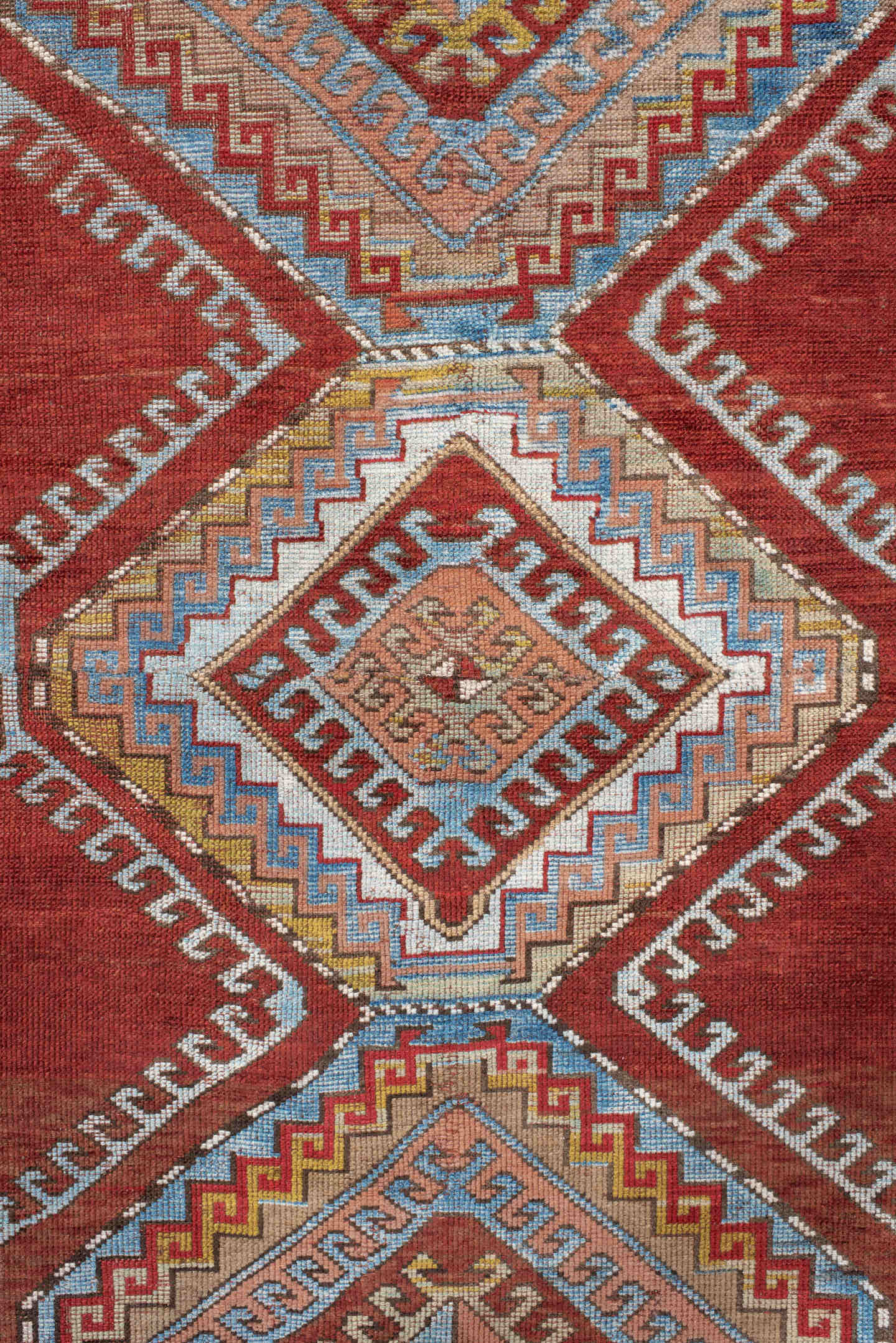 4' x 7' one-of-a-kind handmade vintage Kazak rug. Color palette: rust, ivory, sky blue, brick red, camel, taupe, gold, brown