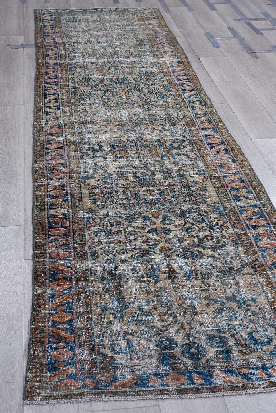 3' x 13' one-of-a-kind handmade vintage runner rug. Color palette: blue, ivory, navy, rust, taupe, charcoal, terracotta