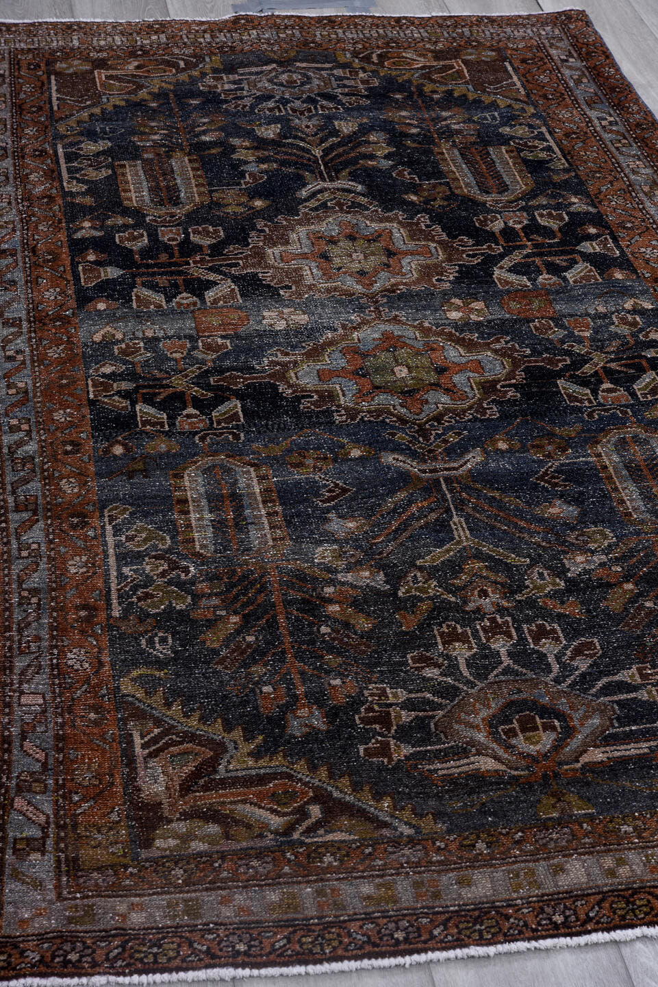 4' x 7' one-of-a-kind handmade antique Hamadan rug. Color palette: navy, rust, ivory, slate, taupe, olive, camel, charcoal