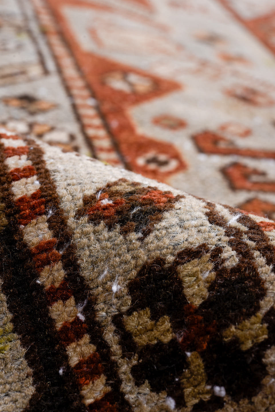 3' x 11' one-of-a-kind handmade antique Heriz runner rug. Color palette: rust, ivory, brown, taupe, charcoal, black, camel