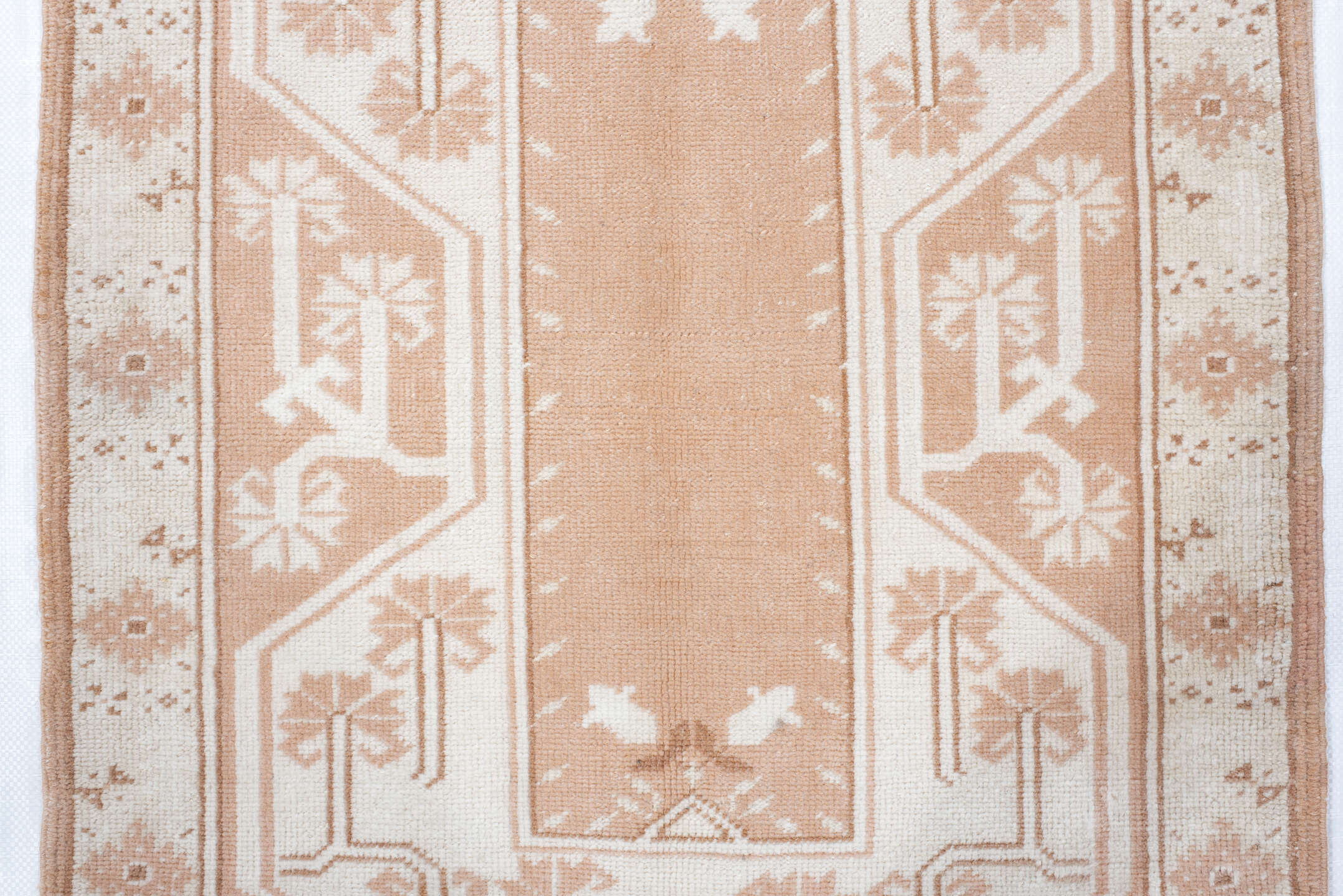 2' x 4' one-of-a-kind handmade antique Anatolian small size rug. Color palette: ivory, blush, peach, sand, camel, pink