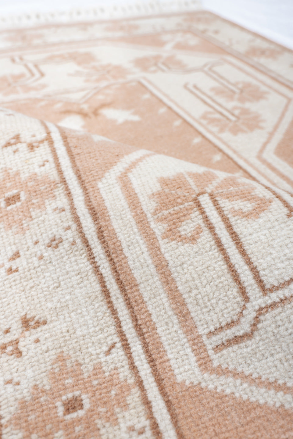 2' x 4' one-of-a-kind handmade antique Anatolian small size rug. Color palette: ivory, blush, peach, sand, camel, pink