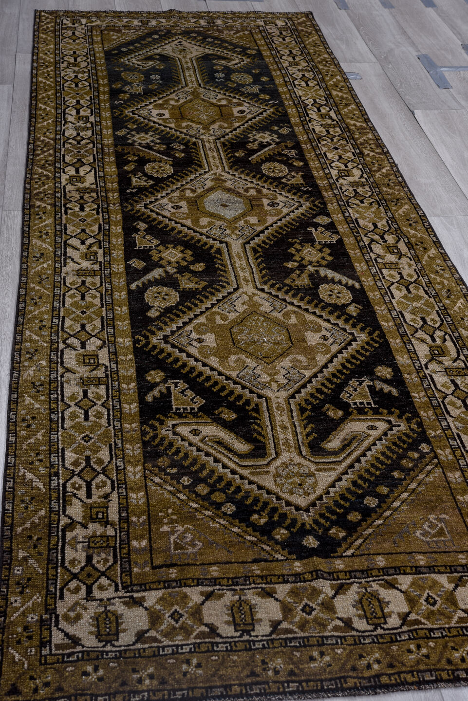 3' x 11' one-of-a-kind handmade vintage Kurd runner rug. Color palette: black, brown, charcoal, gray, light gray, off-white