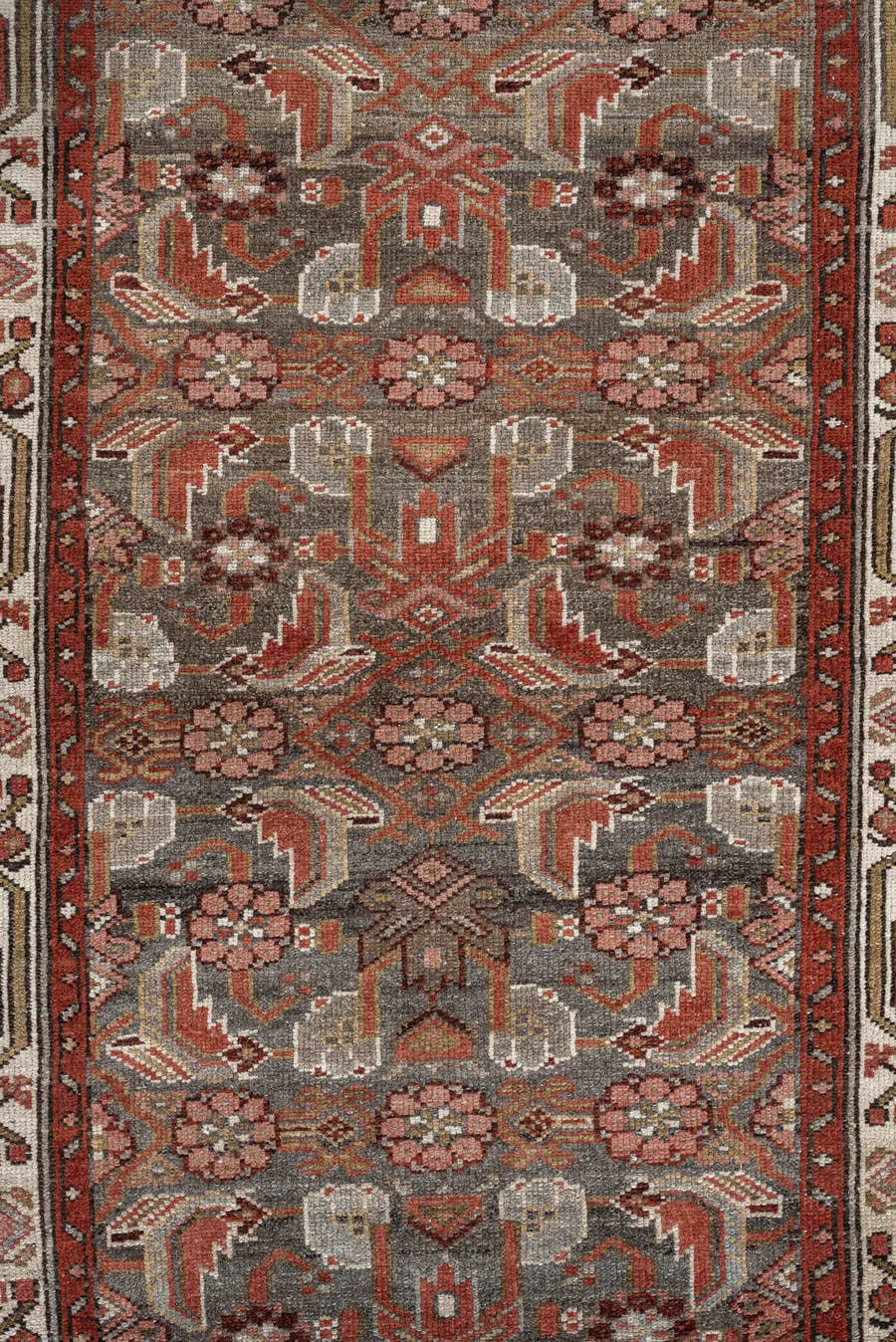 10' x 2' one-of-a-kind handmade vintage rug. Color palette: slate, rust, ivory, terracotta, rose, charcoal, taupe, gray