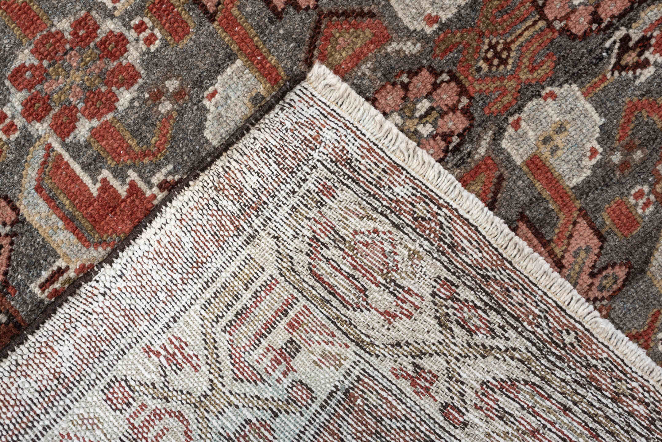 10' x 2' one-of-a-kind handmade vintage rug. Color palette: slate, rust, ivory, terracotta, rose, charcoal, taupe, gray