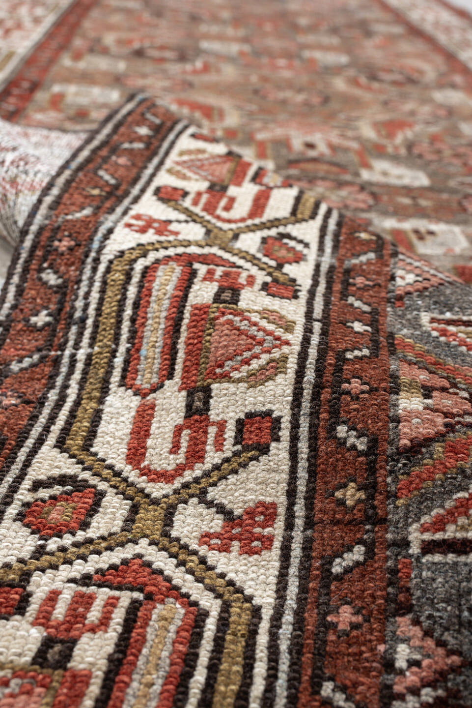 10' x 2' one-of-a-kind handmade vintage rug. Color palette: slate, rust, ivory, terracotta, rose, charcoal, taupe, gray