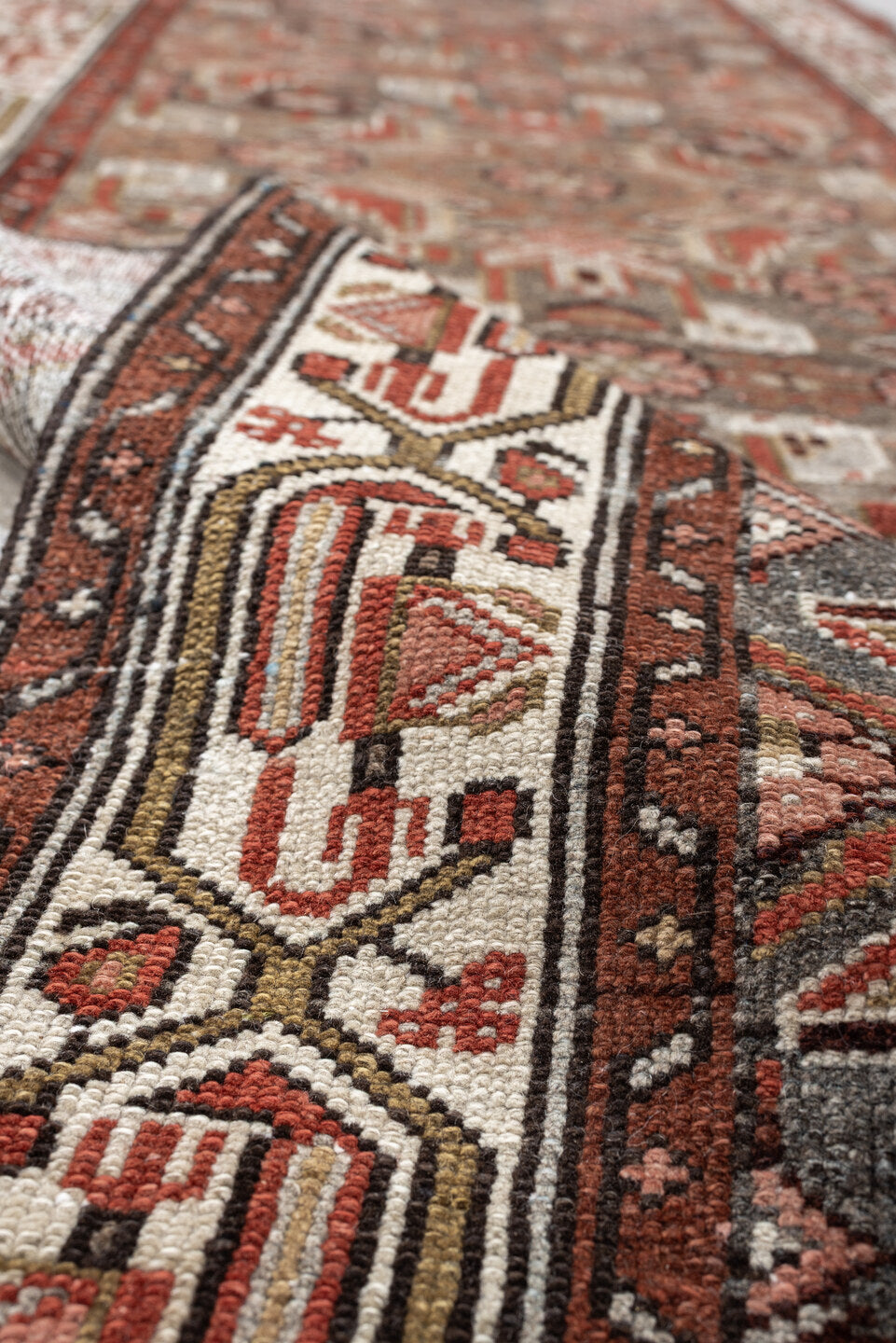 10' x 2' one-of-a-kind handmade vintage rug. Color palette: slate, rust, ivory, terracotta, rose, charcoal, taupe, gray