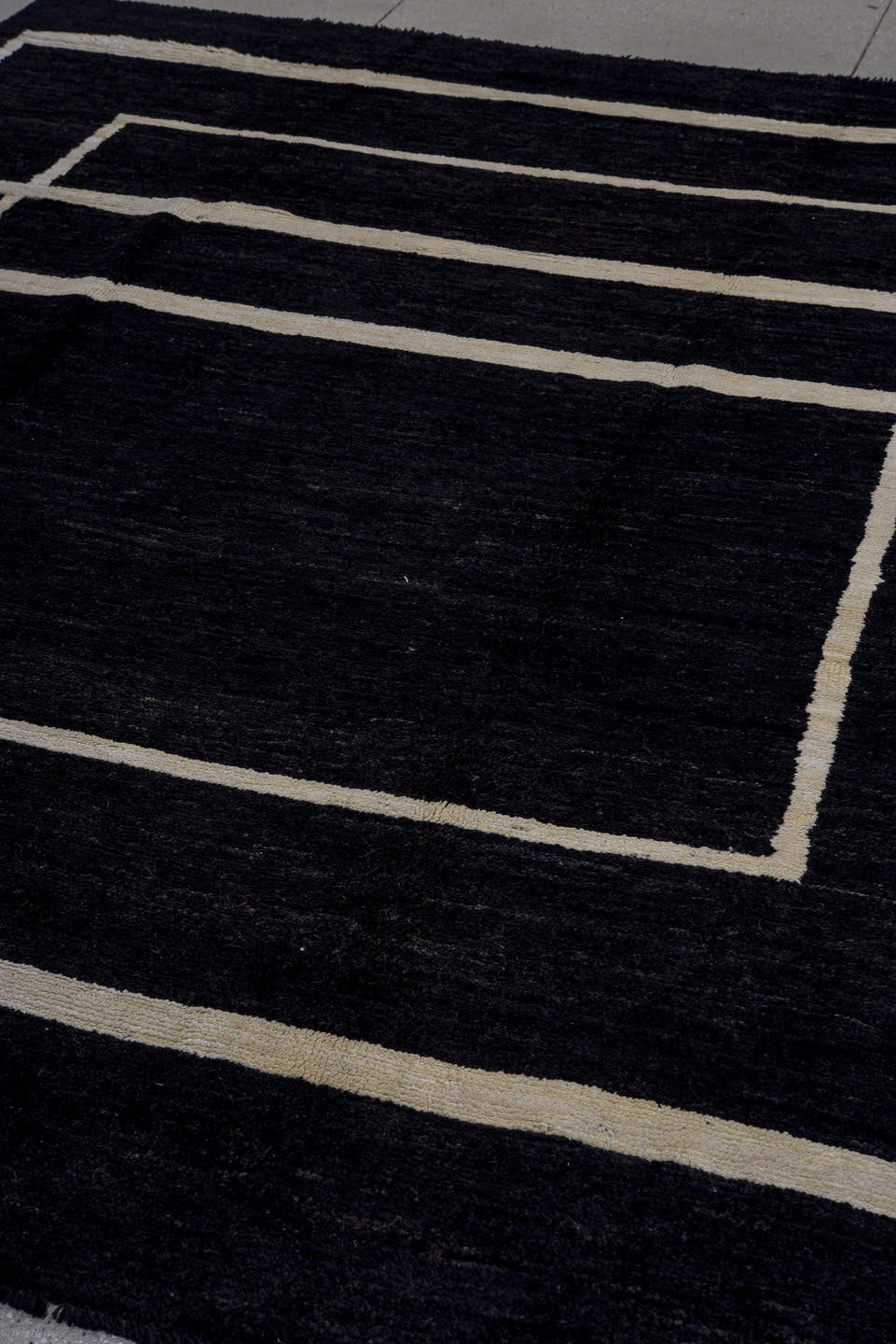 7' x 9' one-of-a-kind handmade vintage Tulu large size rug. Color palette: black, ivory