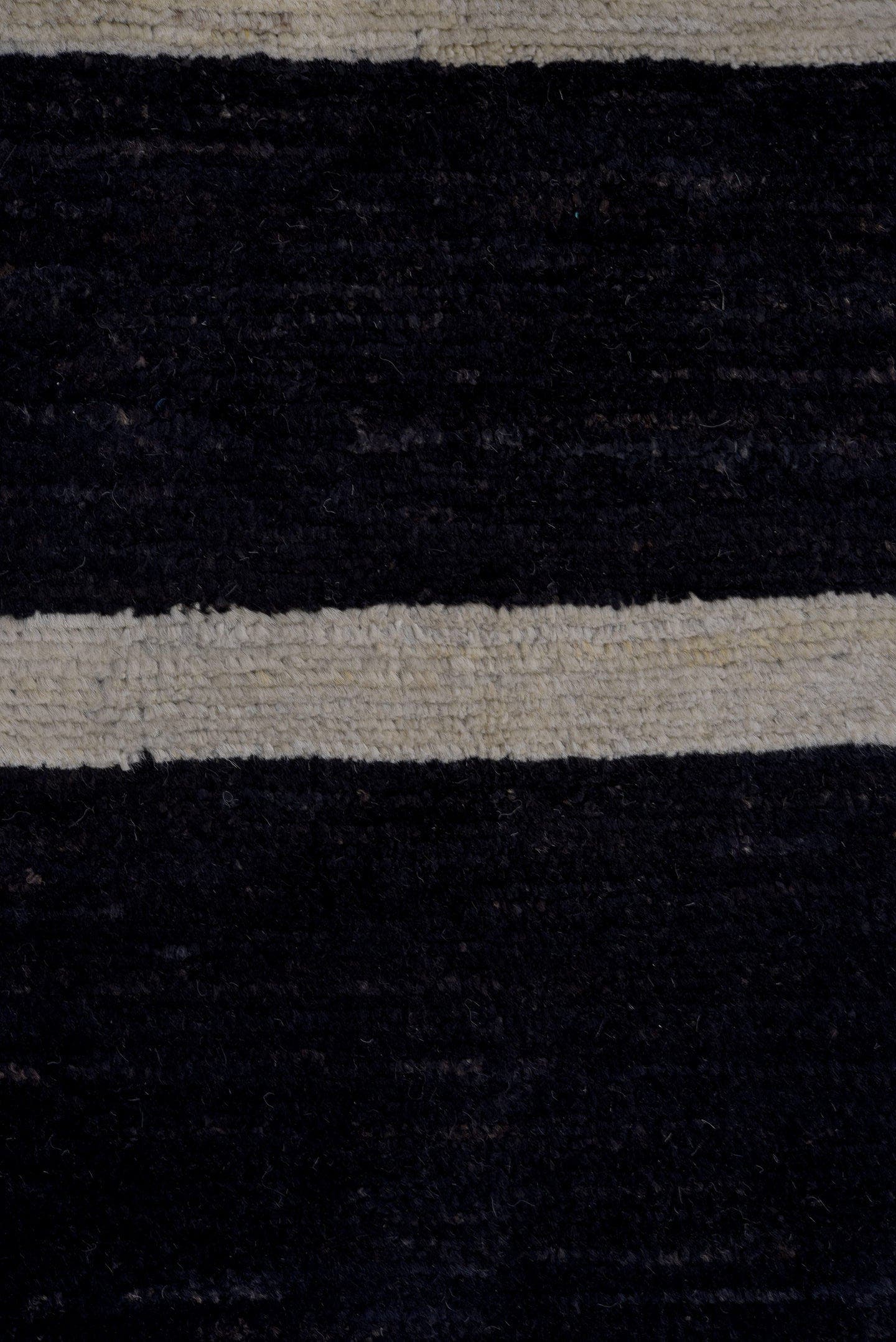 7' x 9' one-of-a-kind handmade vintage Tulu large size rug. Color palette: black, ivory
