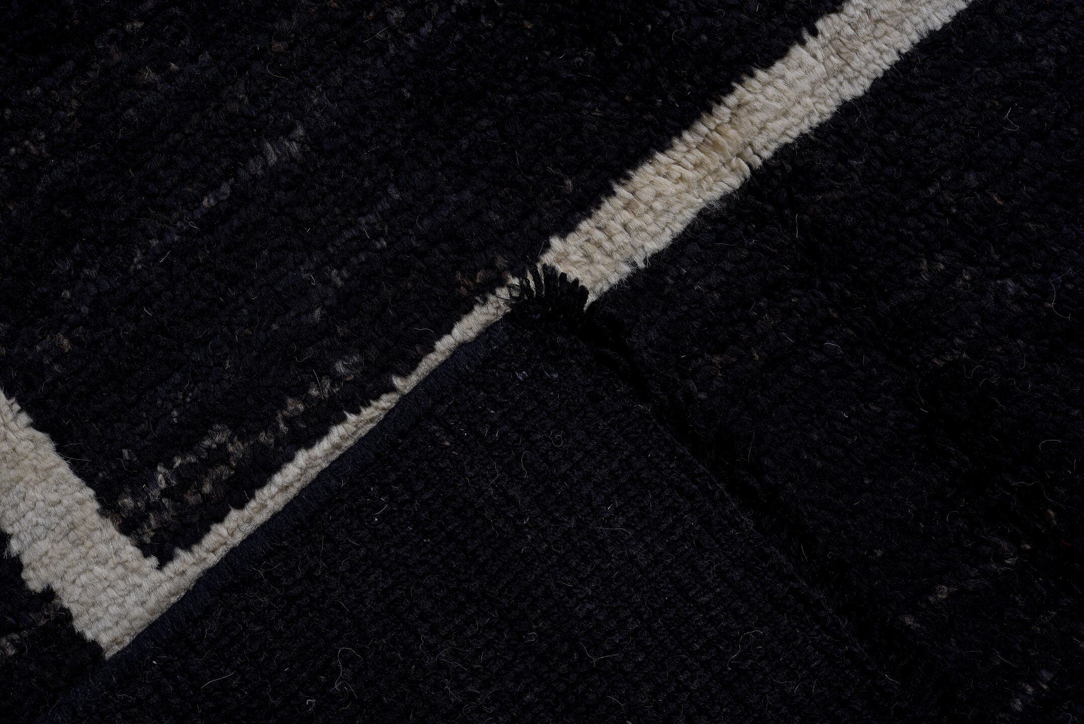 7' x 9' one-of-a-kind handmade vintage Tulu large size rug. Color palette: black, ivory