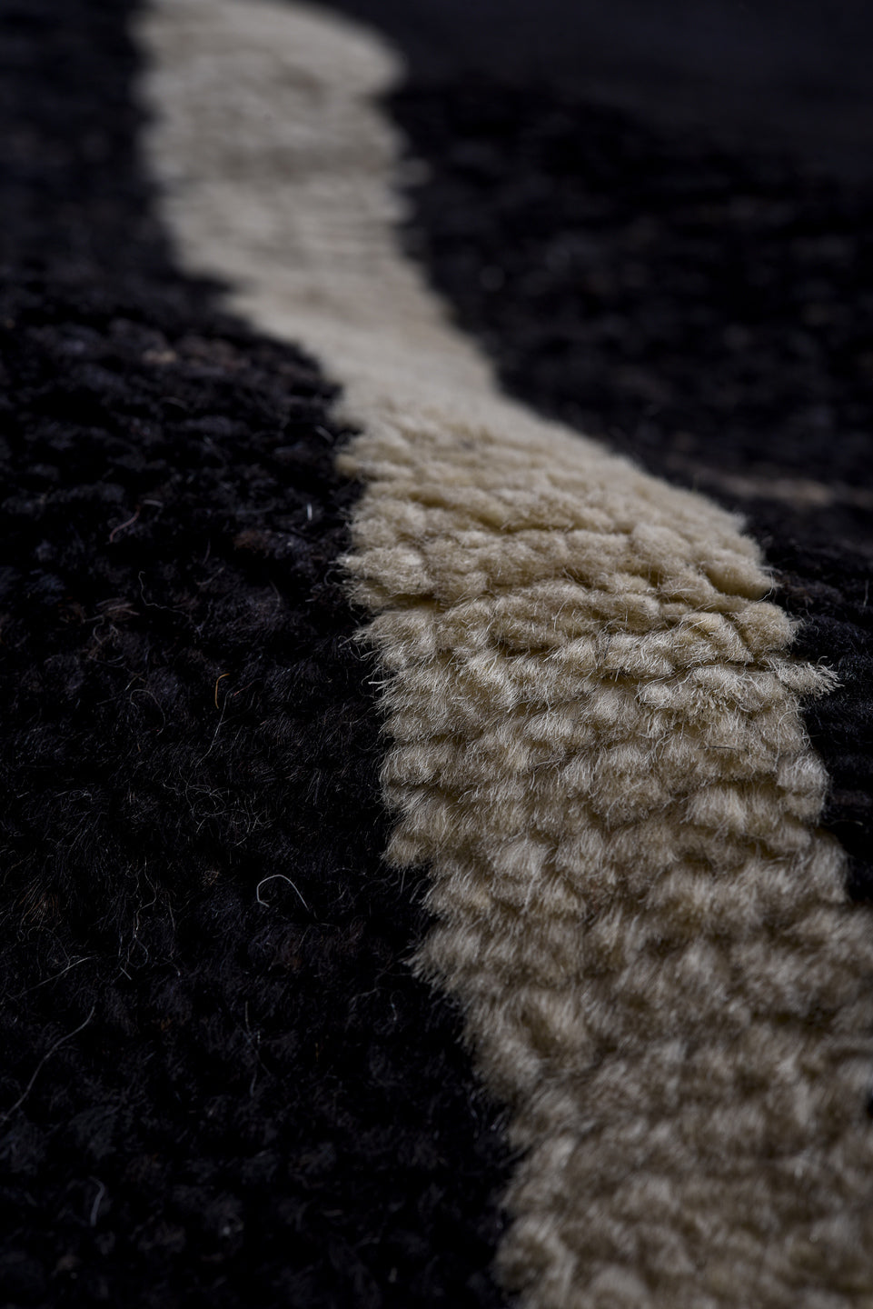 7' x 9' one-of-a-kind handmade vintage Tulu large size rug. Color palette: black, ivory