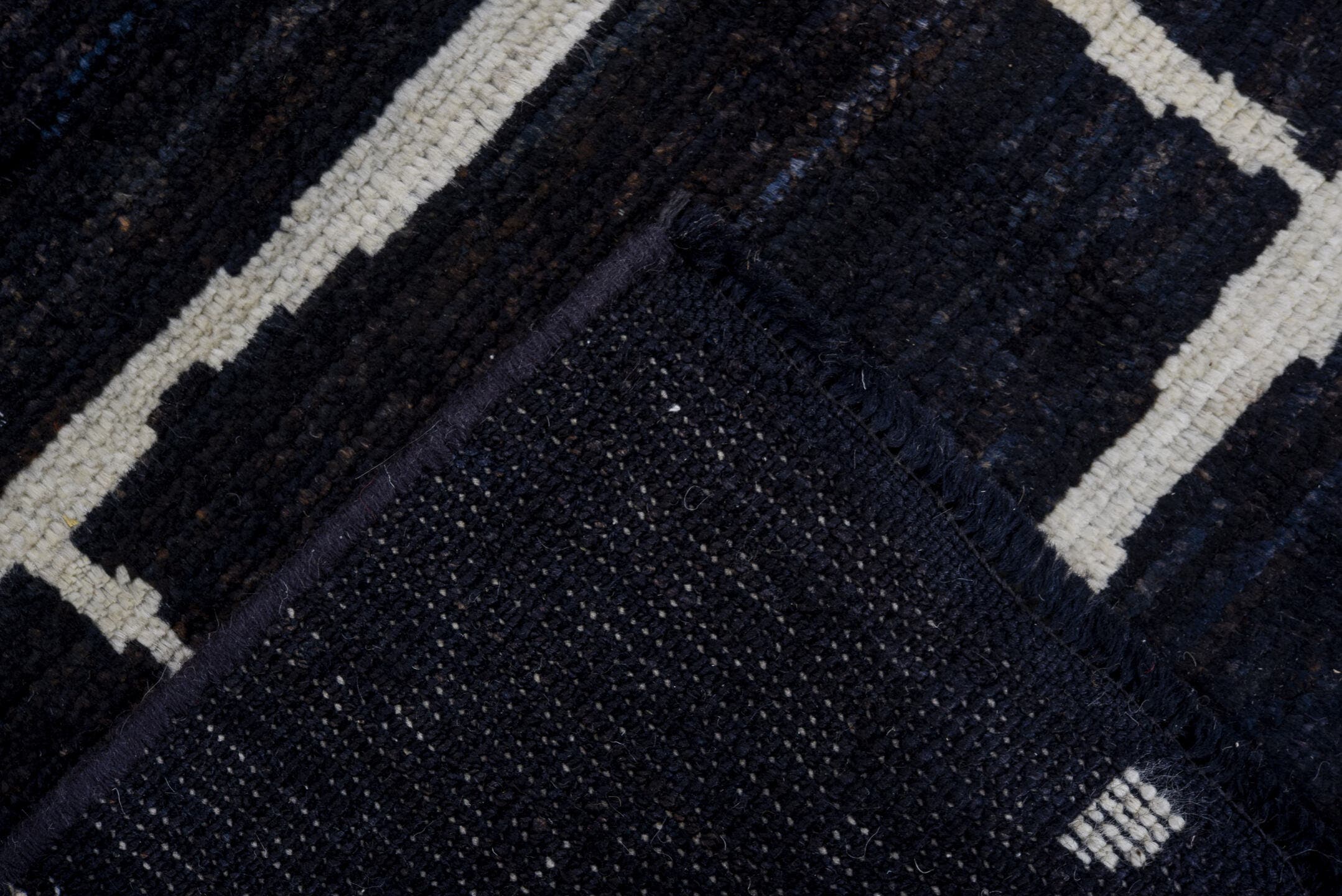 4' x 6' one-of-a-kind handmade vintage Tulu small size rug. Color palette: black, ivory