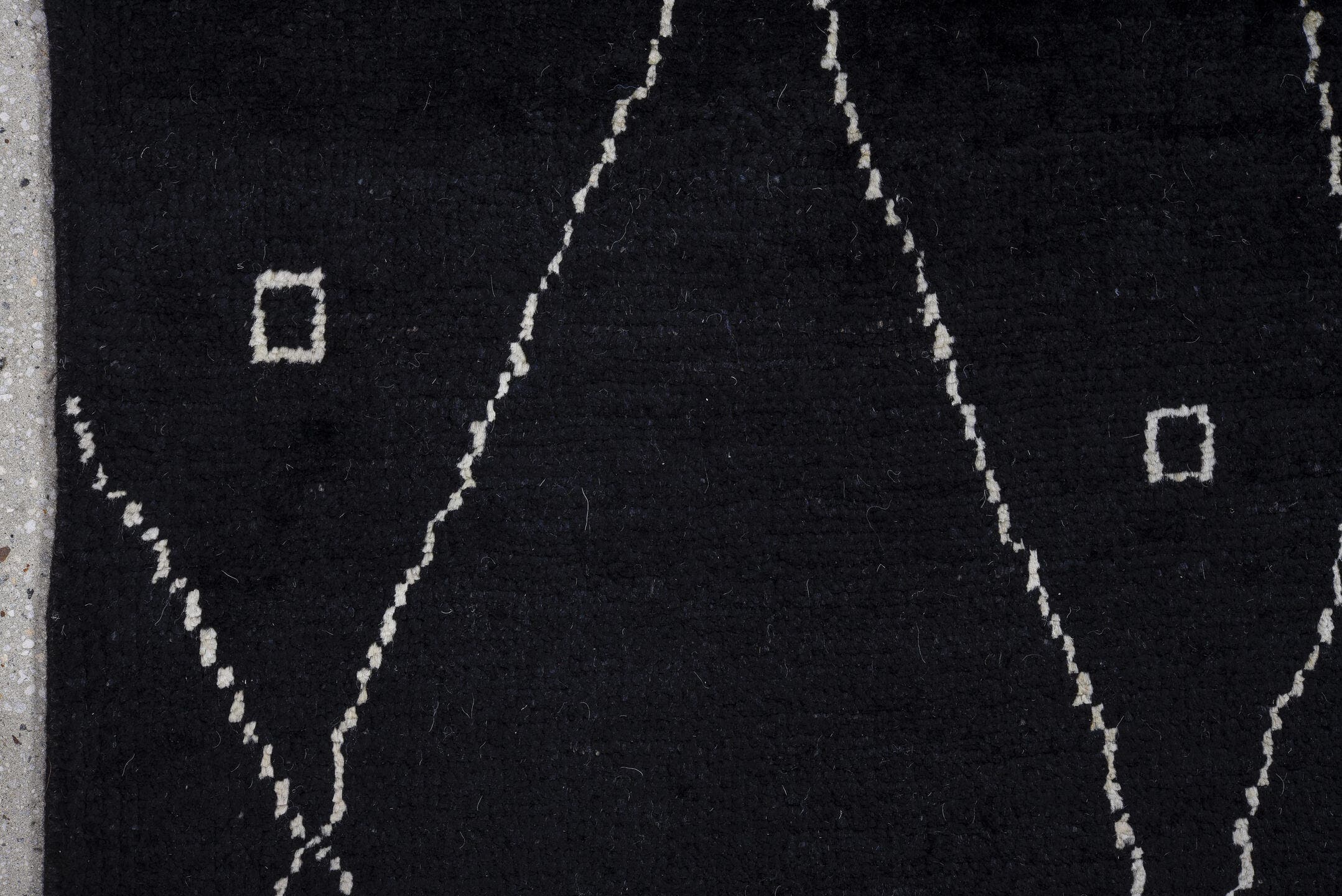 8' x 9' one-of-a-kind handmade vintage Tulu rug. Color palette: black, ivory