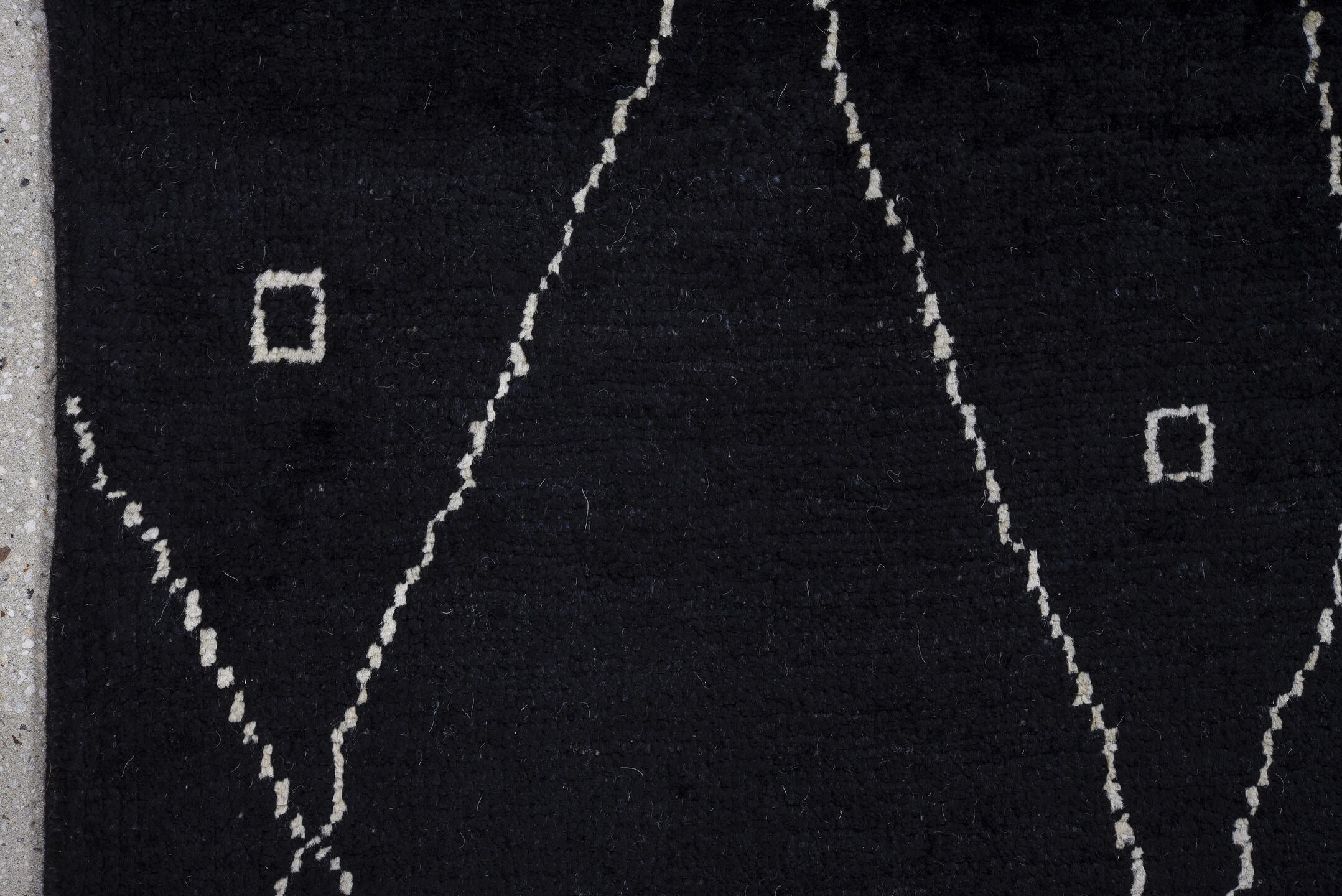 8' x 9' one-of-a-kind handmade vintage Tulu rug. Color palette: black, ivory