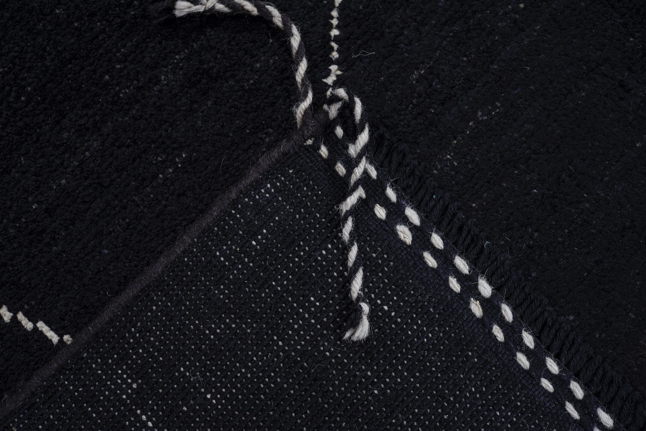8' x 9' one-of-a-kind handmade vintage Tulu rug. Color palette: black, ivory