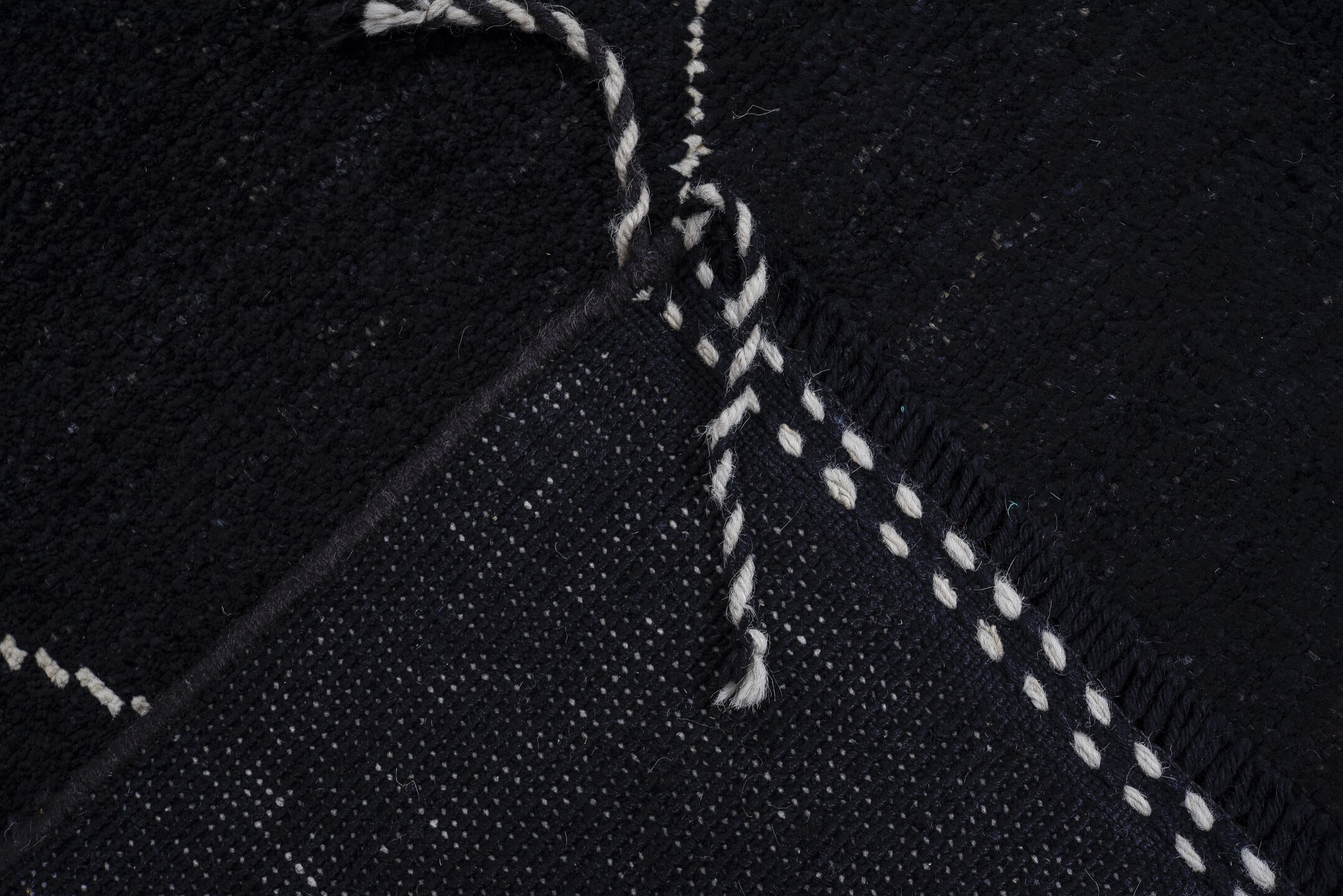 8' x 9' one-of-a-kind handmade vintage Tulu rug. Color palette: black, ivory