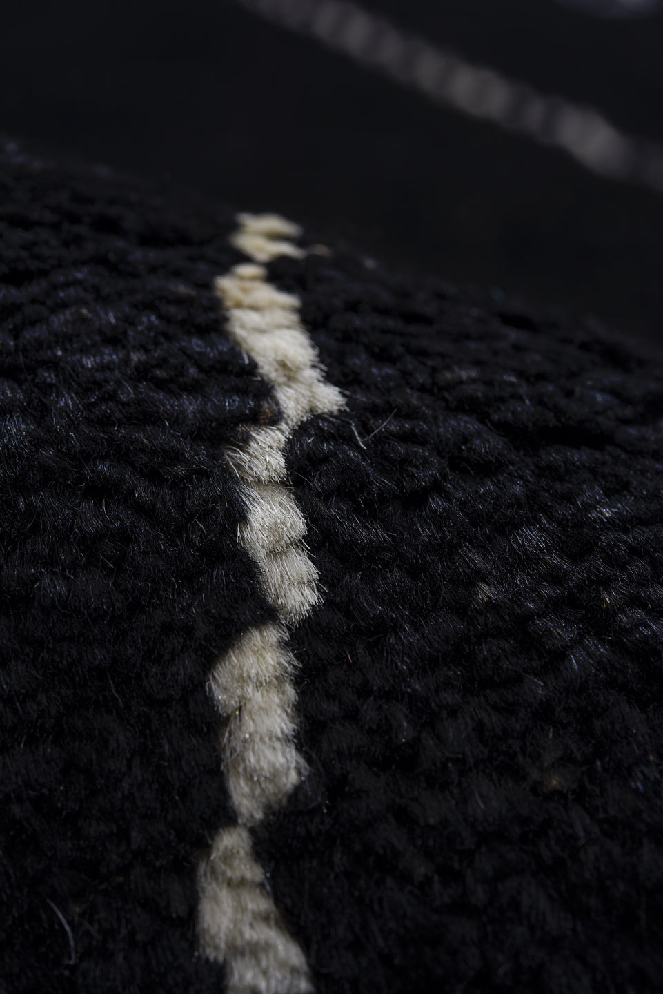 8' x 9' one-of-a-kind handmade vintage Tulu rug. Color palette: black, ivory