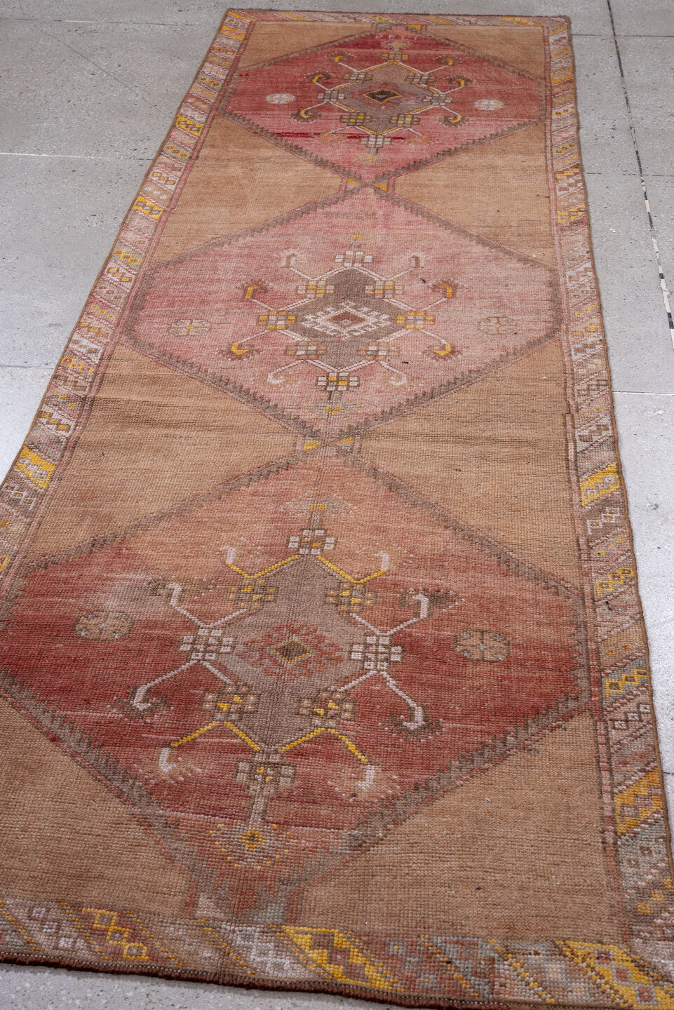 3' x 10' one-of-a-kind handmade vintage Kars runner rug. Color palette: brown, gray, light gray, off-white, orange, pink