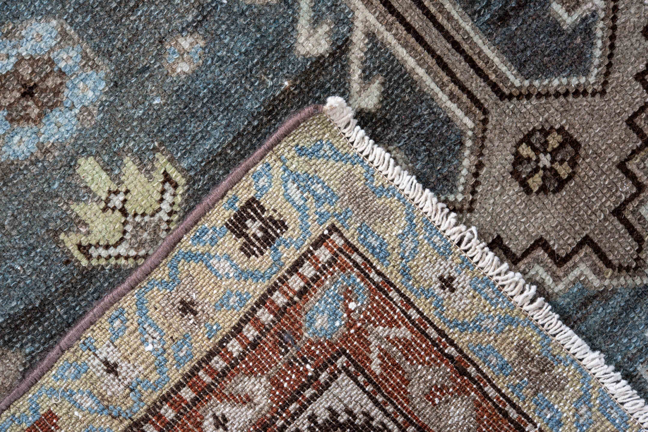 4' x 10' one-of-a-kind handmade vintage Kurd runner rug. Color palette: black, blue, brown, charcoal, dark gray, gray