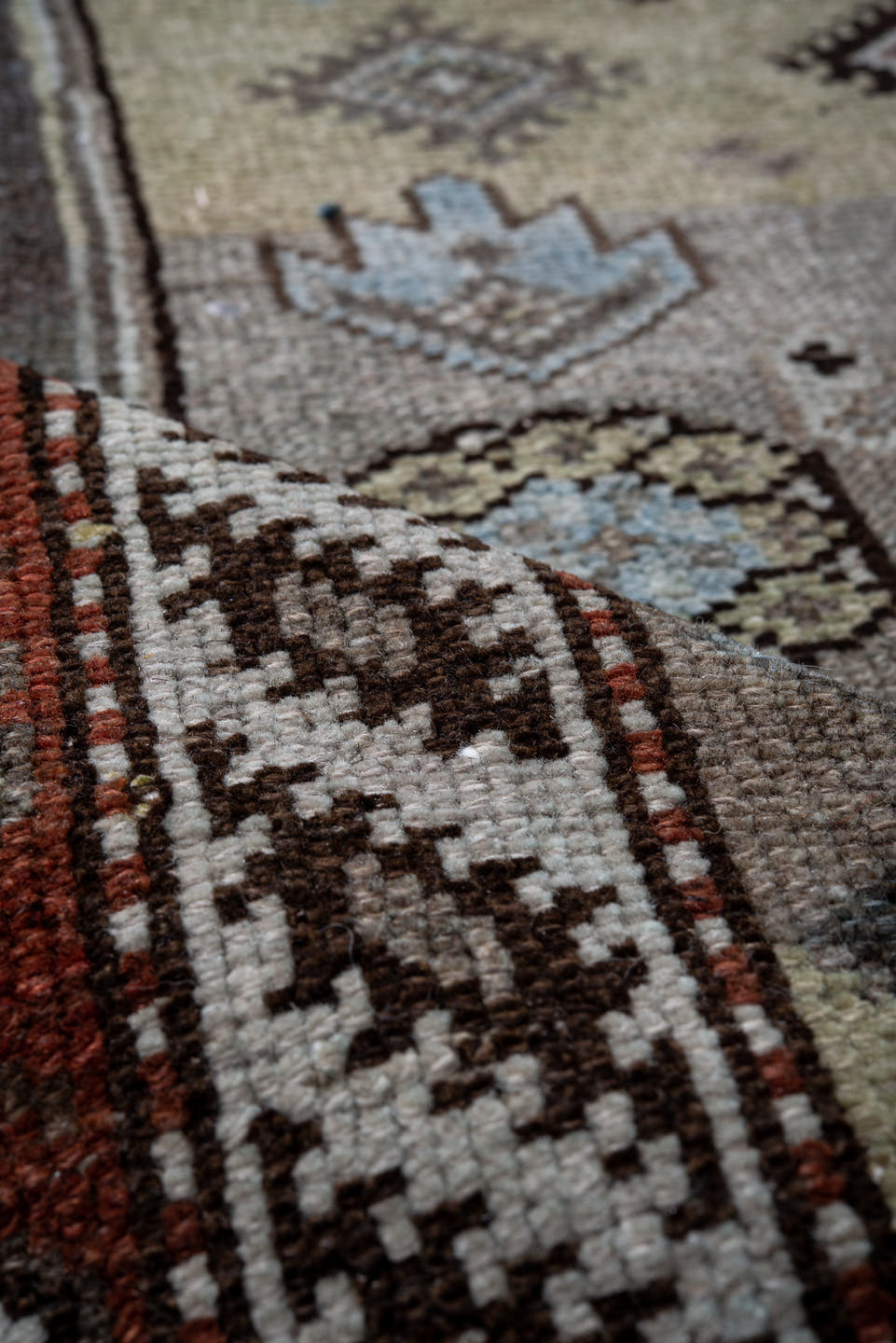 4' x 10' one-of-a-kind handmade antique Kurd runner rug. Color palette: blue, ivory, rust, charcoal, light blue, brown