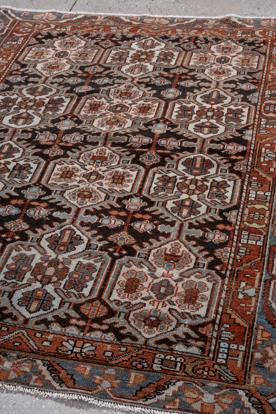 4' x 5' one-of-a-kind handmade vintage Baktiary small size rug. Color palette: black, brown, charcoal, gray, light gray