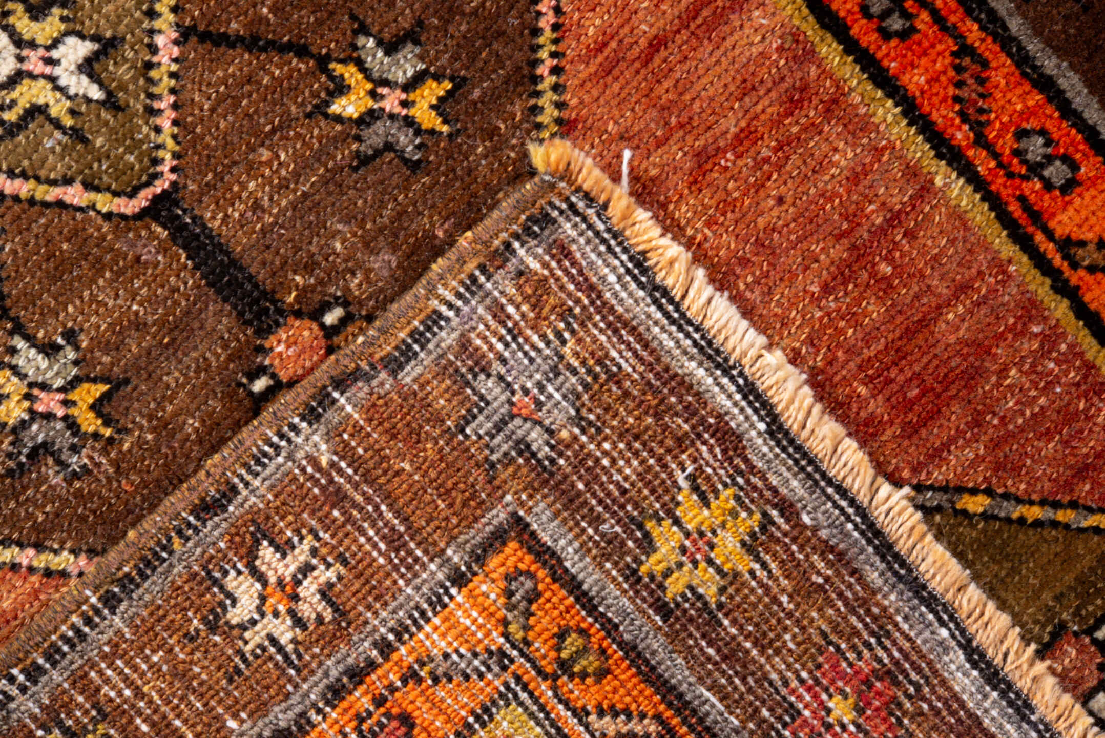 2' x 10' one-of-a-kind handmade vintage Kars runner rug. Color palette: black, brown, gray, off-white, orange, pink, red