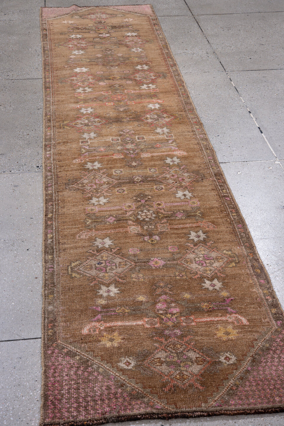 2' x 11' one-of-a-kind handmade antique Kars runner rug. Color palette: camel, taupe, rose, ivory, rust, brown, sage, beige