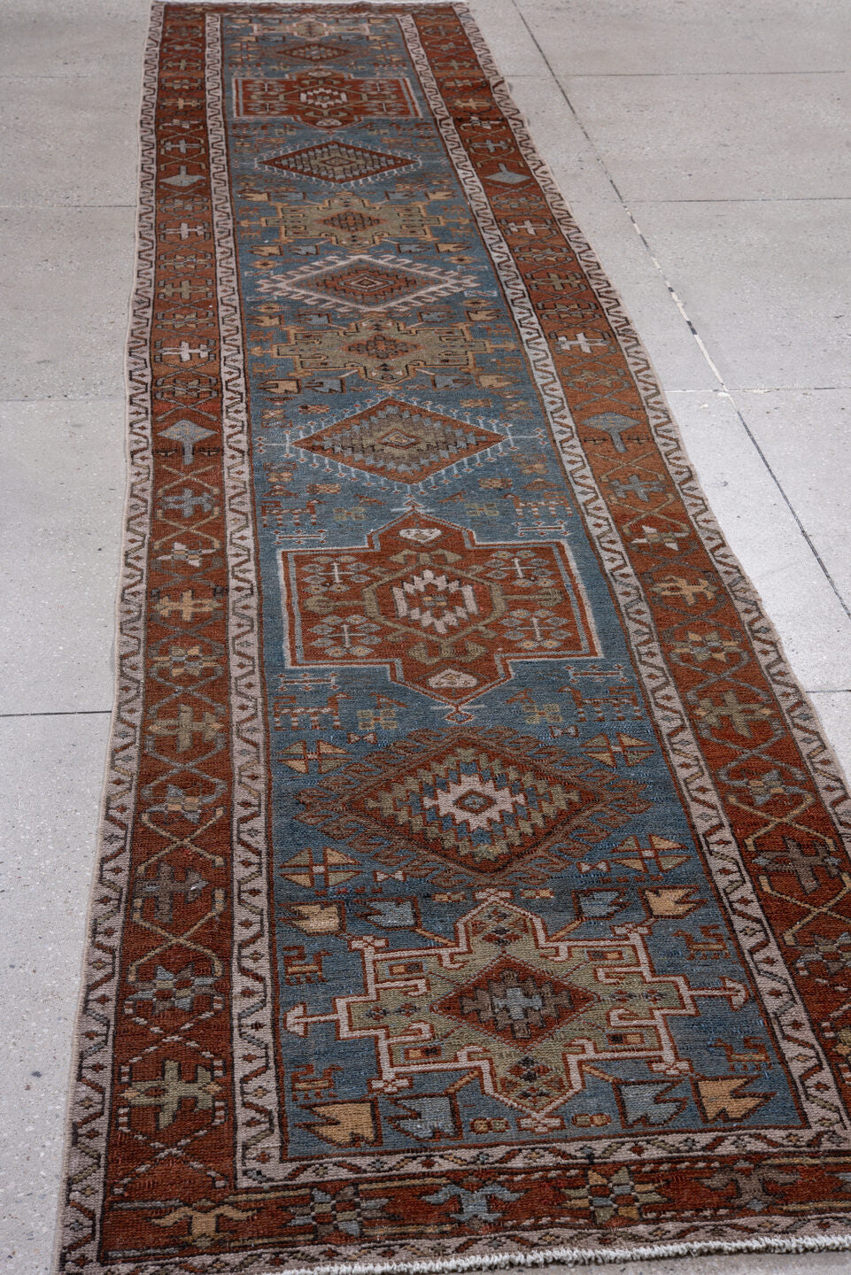 2' x 14' one-of-a-kind handmade vintage Heriz runner rug. Color palette: sky blue, rust, ivory, camel, taupe, brown