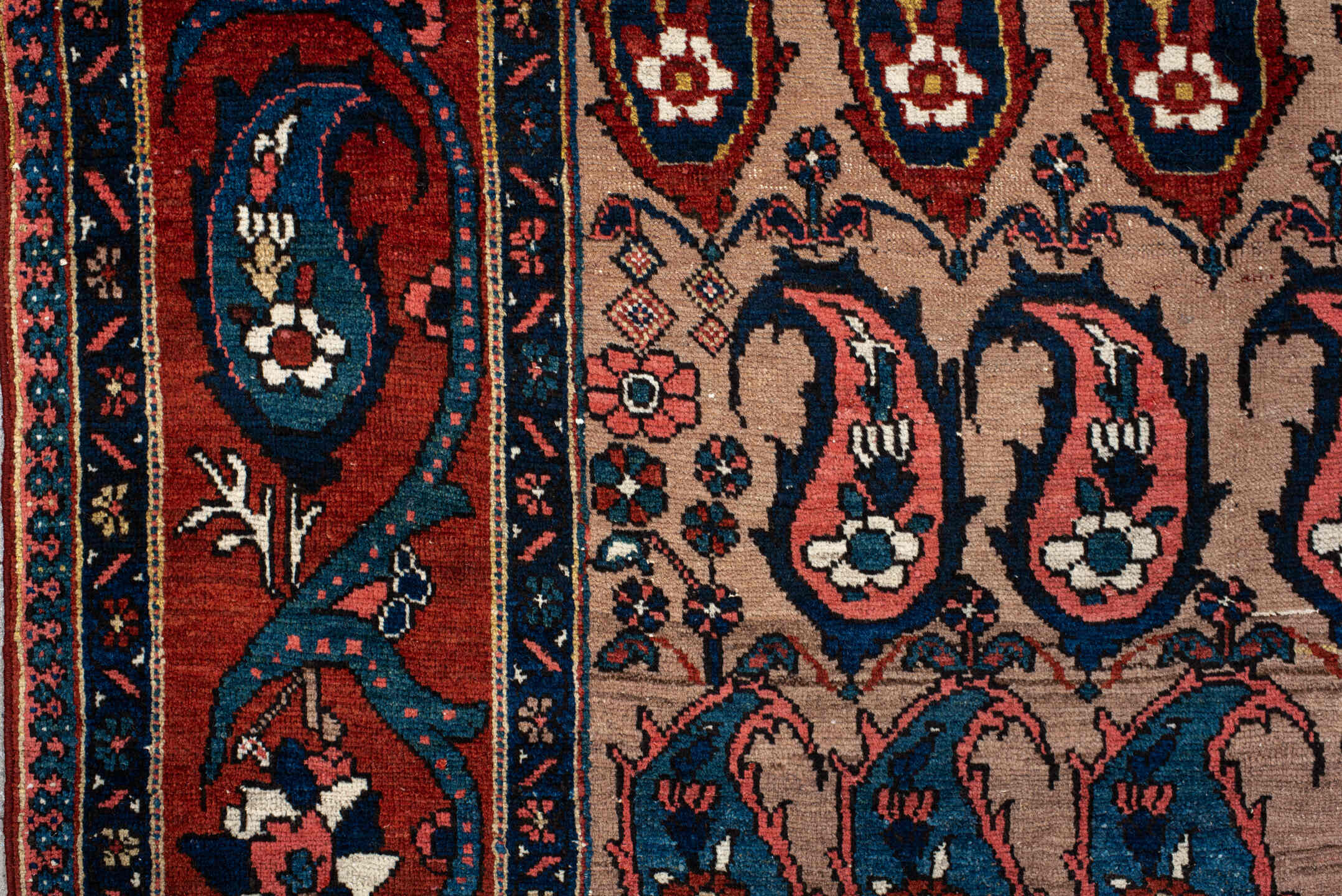 4' x 7' one-of-a-kind handmade antique Baktiary rug. Color palette: rust, indigo, ivory, brick, sky_blue, navy, cream, gold