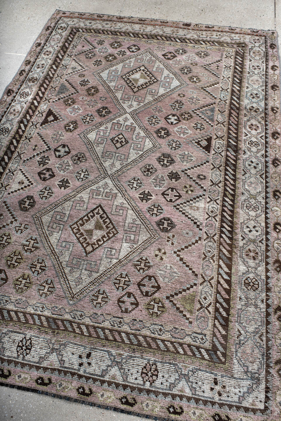 4' x 7' one-of-a-kind handmade antique Shiraz rug. Color palette: rose, ivory, brown, taupe, sage, charcoal, pink, red