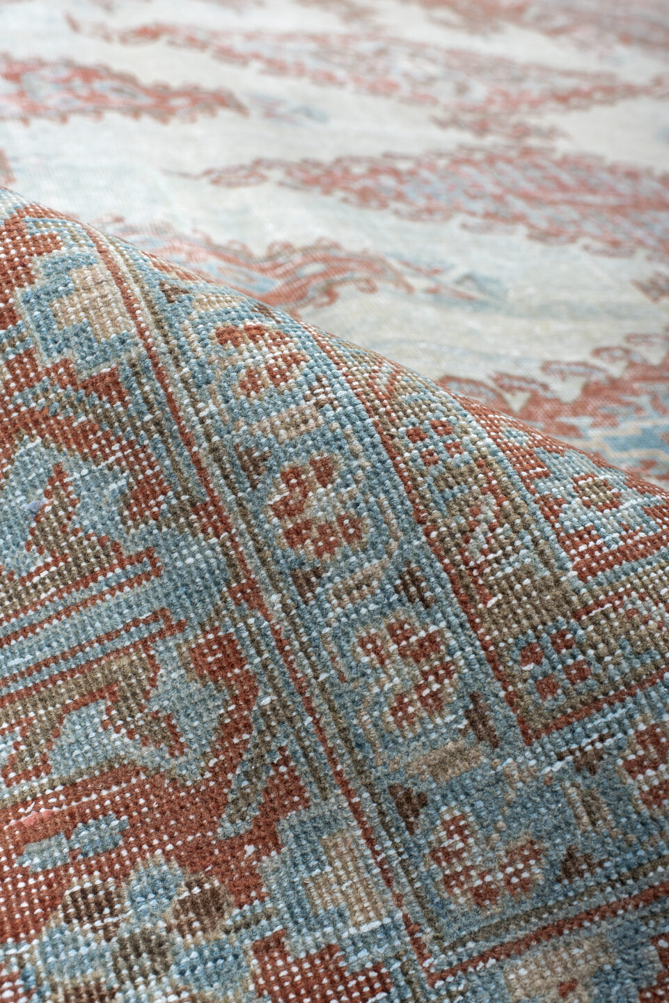 7' x 8' one-of-a-kind handmade antique Veece rug. Color palette: pale blue, rust, ivory, terracotta, sky blue, light blue