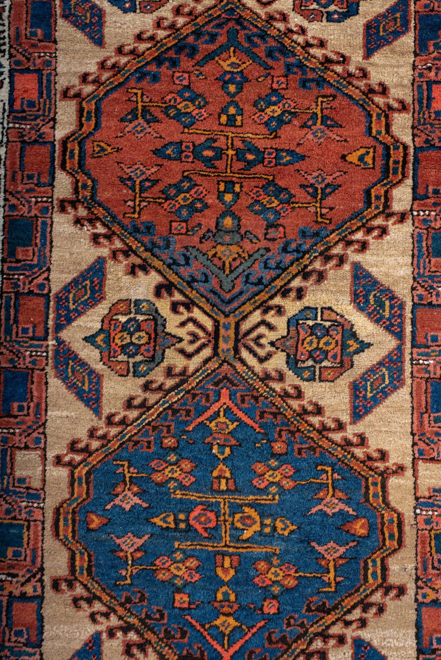 3' x 8' one-of-a-kind handmade antique Sarab runner rug. Color palette: ivory, indigo, rust, navy, terra cotta, camel